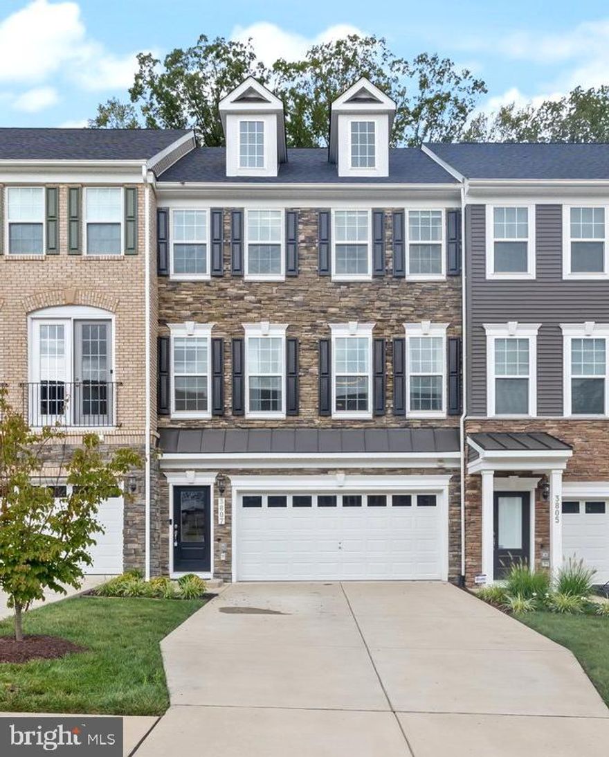 NEW AMAZING PRICE!!!! MOTIVATED SELLER! Welcome to this beautifully appointed interior townhome with a 2-car garage and four spacious levels of modern living, ideally located just minutes from major commuter routes. Featuring three bedrooms, two full bathrooms, and three half bathrooms, this home offers a perfect blend of comfort, functionality, and style.
The main level boasts an open, sun-filled living area that flows effortlessly into the chef’s kitchen, complete with premium stainless steel appliances (WiFi enabled), a large island with newly installed pendant lighting, and a sleek design ideal for entertaining. A built-in closet on this level adds valuable storage, and dimmer switches have been added throughout the main level and staircase for enhanced ambiance. A convenient half bath and dining area complete the space.
Upstairs, the luxurious primary suite features a spa-like bathroom and a generous walk-in closet. Two additional spacious bedrooms, a full bath, and a laundry area provide comfort and convenience for family or guests.
The top-level loft is a flexible space perfect for a home office, media room, or guest suite, with an additional half bath for added functionality. From here, step out onto the rooftop terrace—a peaceful outdoor space ideal for relaxing or entertaining with beautiful, elevated views.
The finished lower level offers even more versatility for recreation, fitness, or work-from-home needs, along with another half bath. Additional features include an EV charger, a new water filtration system in the kitchen, and thoughtful smart home upgrades throughout.
With abundant natural light, modern finishes, and meticulous care throughout, this home offers elevated living in an outstanding location—just 15 minutes to Andrews AFB and downtown DC. Schedule your private showing today and discover all this home has to offer!