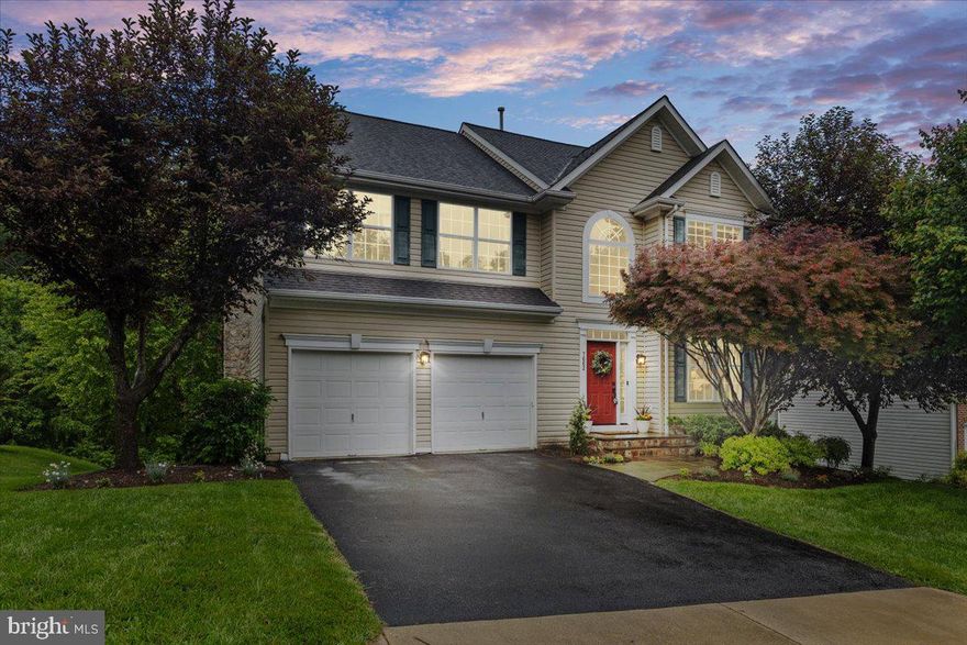 Welcome to this spacious and beautifully updated detached home, offering a perfect blend of comfort, style, and nature. The cathedral entry foyer opens to a bright, airy main level featuring an open floor plan with crown molding in the foyer, living, and dining rooms. The gourmet kitchen is a chef’s dream with abundant cabinetry, granite counters, stone backsplash, a large island, breakfast area, double-door pantry, and sleek black stainless steel appliances including a brand new dishwasher and gas stove. New flooring enhances the living, dining, and kitchen areas. The cozy family room, with its wood burning fireplace framed in stone (inside and out) and a wall of windows, showcases serene wooded views. Upstairs, the expansive primary suite spans the entire rear of the home and boasts vaulted ceilings, a sitting area, walk-in closet, and a spa-like bath with soaking tub, dual vanities, and separate shower. Three additional bedrooms, two full baths, laundry area, and new carpeting complete the upper level. The finished basement includes a built-in bookcase, kitchenette/wet bar, bedroom with French doors and walk-in closet.  Step outside to a huge Trex deck (2015), ideal for relaxing and enjoying the surrounding wildlife - deer, foxes, birds, rabbits and more. Updated bath fixtures throughout and a new roof (2022) add to the home's value and appeal.