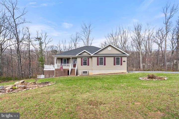 Welcome home to 202 Doe Trail! This lovely ranch is on lease with more than 0.30 acres of space and comfort, simply awaiting for your gardening skills! Walk into the lovely, very well maintained home, with a freshly painted kitchen, open floor plan and three well sized bedrooms. The sellers added a slider door and beautiful deck to the home in 2022 and it's simply begging for a BBQ, company and a beverage of your choice as you enjoy the quiet around you. The carpets have been recently steam cleaned, the home is in wonderful shape and ready to move in. Make your appointment today!
