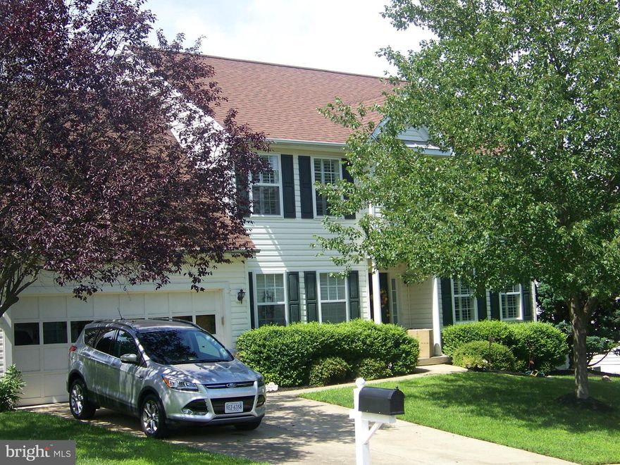 Lovely colonial w/hardwood floors throughout main level and 3 of the 4 bedrooms. Open kitchen with breakfast bar opens to spacious family room w/fireplace. Large rec. room w/full bath in basement. Plantation blinds throughout main and upper level. Private fenced backyard with ample deck and brick patio that backs to trees. Minutes from I-95 and commuter lots, easy commute to Quantico Marine Base.