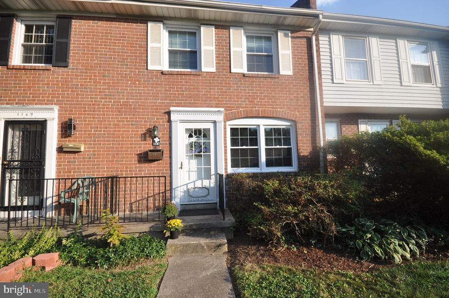 Welcome to 1147 Pelham Wood Road. This brick rowhome has a new roof (2022), new hot water heater (2020) and replacement windows. You'll find a parking pad in the rear of the home as well as on-street parking. Hardwood floors can be found throughout the home. The living room leads into the dining room with chair rail, just steps away from the kitchen. Upstairs, there are three bedrooms along with a full bathroom that has been updated. There is an attic - accessible with pull-down stairs for additional storage. The lower level is unfinished leaving you to create a space you want. The chairlift is included with the sale.
