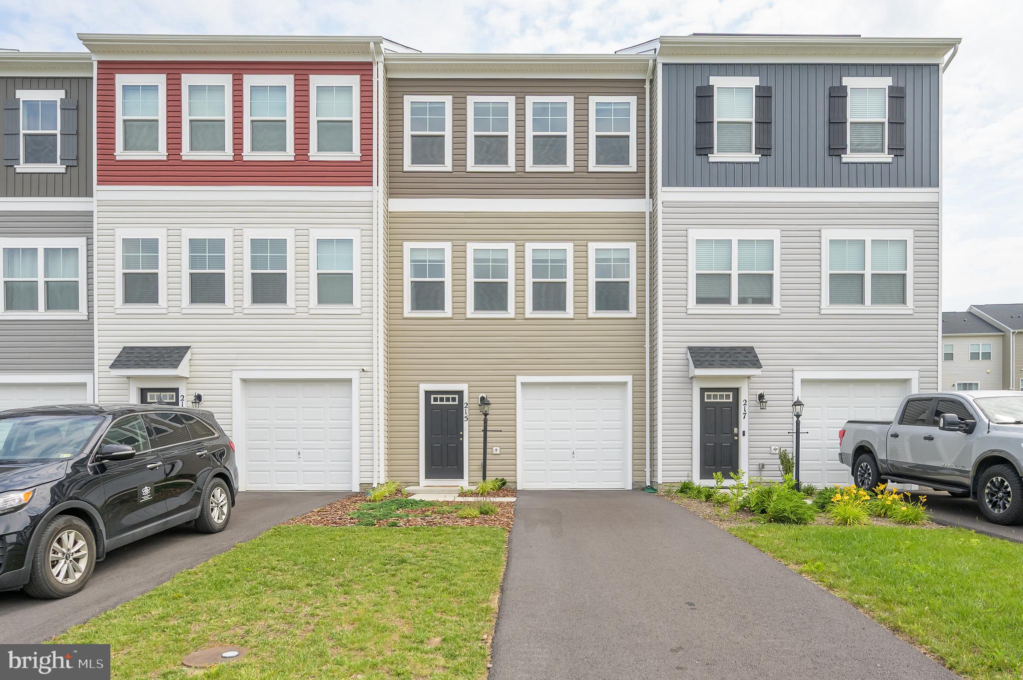 Welcome to this beautiful, nearly new townhouse located in the highly sought-after Snowden Bridge community! Built just two years ago, this stunning Skyline model offers 1,830 square feet of thoughtfully designed living space across three fully finished levels. Inside, you’ll find 3 spacious bedrooms, 2 full bathrooms, 2 half baths, and an attached one-car garage. The main living level features a modern, upgraded kitchen with stainless steel appliances, granite countertops, a gas range, and a dedicated dining space. The open-concept layout flows seamlessly into a bright and airy living room and provides easy access to the rear deck. Upstairs, the primary suite offers a private retreat with a full en-suite bath. Two additional bedrooms, a full hall bath, and a laundry area with washer and dryer complete the upper level. The versatile lower level provides a second living area that can serve as a home office, guest suite, or recreation room, and includes a half bath and walk-out access to the backyard. Snowden Bridge offers resort-style amenities, including a swimming pool, pirate-themed water park, clubhouse, tennis and basketball courts, dog park, playgrounds, a bike track, walking trails, and a picnic pavilion. With easy access to I-81 and just a short drive to Winchester, this home combines comfort, style, and convenience in a vibrant community setting.