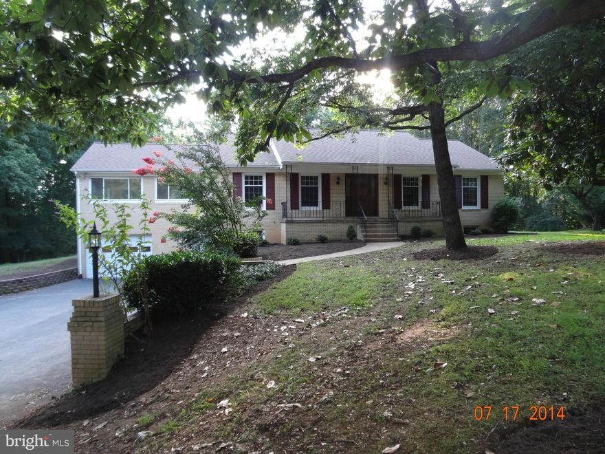 Must see to appreciate space! Just over the Fairfax County line. 1 Acre lot with mature trees. Shows well. OP High School. Silestone Counters in Kitchen. Huge Windows to enjoy View of Treed Property. Hardwood floors. Tiled floors in Spacious Baths. Newer Roof. 2 wood burning Fireplaces. Spacious Foyer. Deck. Sliding glass doors off Dining Room and Rec Room. Storage Room, Huge Laundry Room+ More!