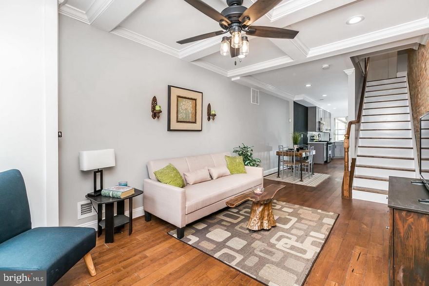 This stunning 4-bedroom, 3.5-bath home in the heart of Fells Point offers modern living with a touch of historic charm. The open floor plan flows seamlessly through the living room, which boasts coffered ceilings and exposed brick, adding character and warmth. Gleaming hardwood floors run throughout the home. The gourmet kitchen is a chef’s dream, featuring sleek quartz countertops, stainless steel appliances, and ample cabinet space for storage. Outdoor living is at its finest with three decks, including an expansive rooftop deck offering sensational views of Charm City. This home also includes a wine cellar, perfect for entertaining. Located in a prime area close to vibrant restaurants and shopping, this property combines luxury, style, and convenience.