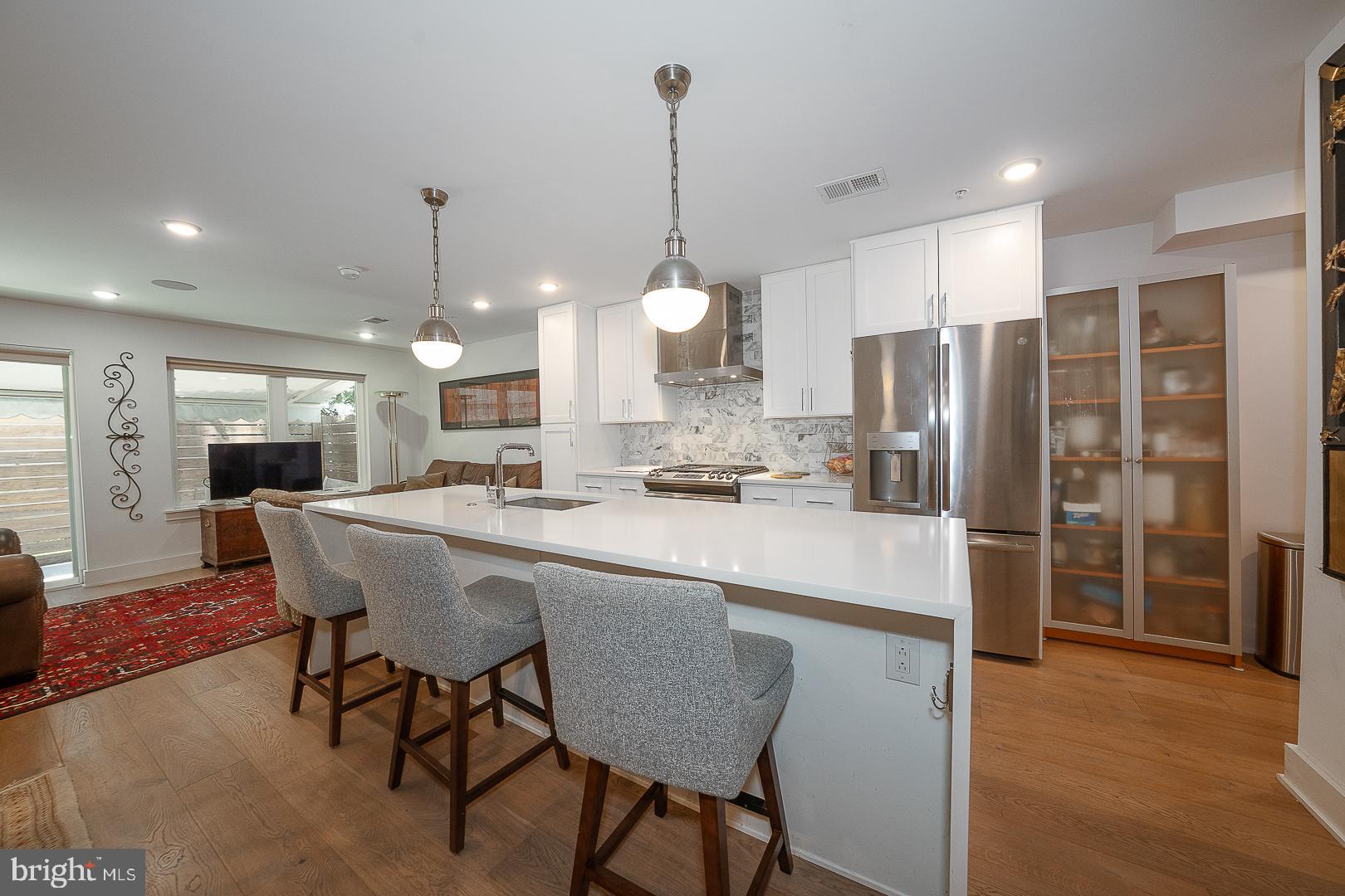 Welcome to this stunning 3 bedroom/3 bathroom condominium home featuring 1800 square feet of luxury space located in a boutique building in vibrant Francisville! Thoughtfully designed with a sun-drenched open floor plan, this home blends style, comfort, and convenience in one of Philadelphia’s most desirable neighborhoods.
Step into the main level and be greeted by a beautifully bright and airy living space featuring a chef-inspired kitchen with tall, white shaker cabinetry, gleaming stainless steel appliances, sleek white quartz countertops, and a striking subway tile backsplash. The spacious living room & dining room flow seamlessly to a large private patio with a wonderful retractable awning, and is ideal for outdoor entertaining or relaxing evenings at home. The main floor also features a generously sized bedroom suite complete with a spectacular luxurious bathroom and an oversized walk-in closet. Downstairs, the lower level offers two additional ensuite bedrooms, each with their own fabulous spa-like bathrooms. A flexible open area on this level provides the perfect space for a home office, den, or gym—tailored to your lifestyle needs. Beautiful wood floors throughout. Approx. 4-5 years left on the tax abatement!
Perfectly situated just steps from public transportation, the shops and dining of Fairmount Avenue, and all of the cultural attractions of the Art Museum Area, this home offers the best of city living in a quiet, boutique setting.