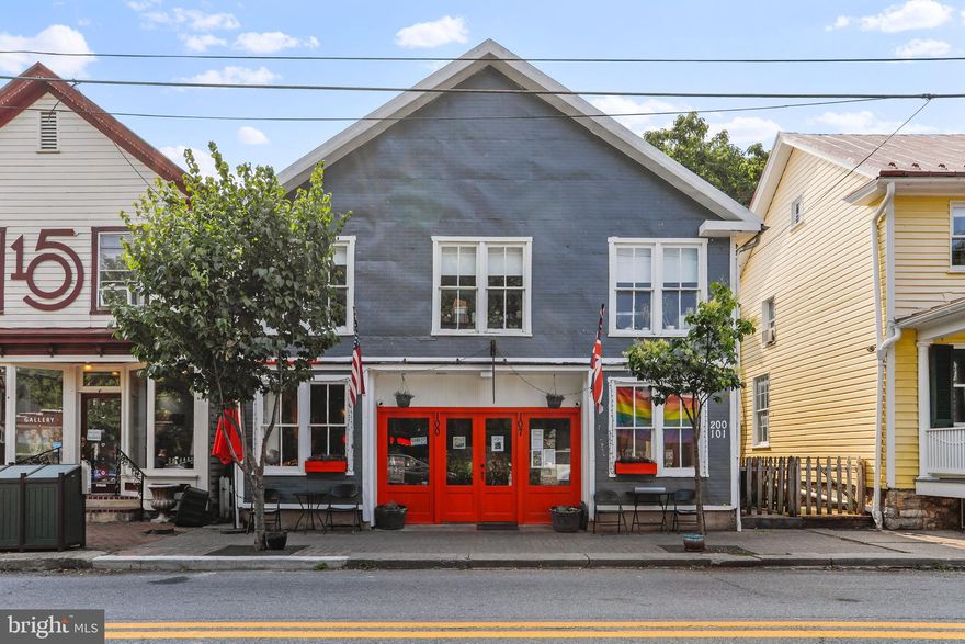 The Devonshire Arms, one of the classic pubs and restaurants in historic Shepherdstown WV has hit the market.  The building features a 2 BR, 1 BA, 2 level "townhome" behind the restaurant, a 1 BR 1 BA Loft style apartment over the restaurant and a wonderfully busy Authentic British Pub.  The building was an old carriage house converted to the pub and residences over the years.  With the real estate, the business is being sold and is included in the list price of the property.  Current Profit and Loss statements are attached in Documents for review.  The current 2 BR "townhome" is rented to a long term tenant and the the current owner lives in the loft above.   The pub could be made more into a restaurant environment with some construction to open up the smaller kitchen and taking the space from the main level of the townhome and a new owner could easily open up the loft upstairs for more seating for the restaurant using the stairs already in place.  The opportunities are endless for the space and the location is prime just two blocks from Shepherd University and less than a block from historic German St, Shepherdstown's main street.  The current owner may be able to offer Seller Held Financing for the right buyer with a successful history in the industry.  For Owner Financing Seller must be in First Position with minimum of $150K down and remainder to balloon at mutually agreeable timeframe.