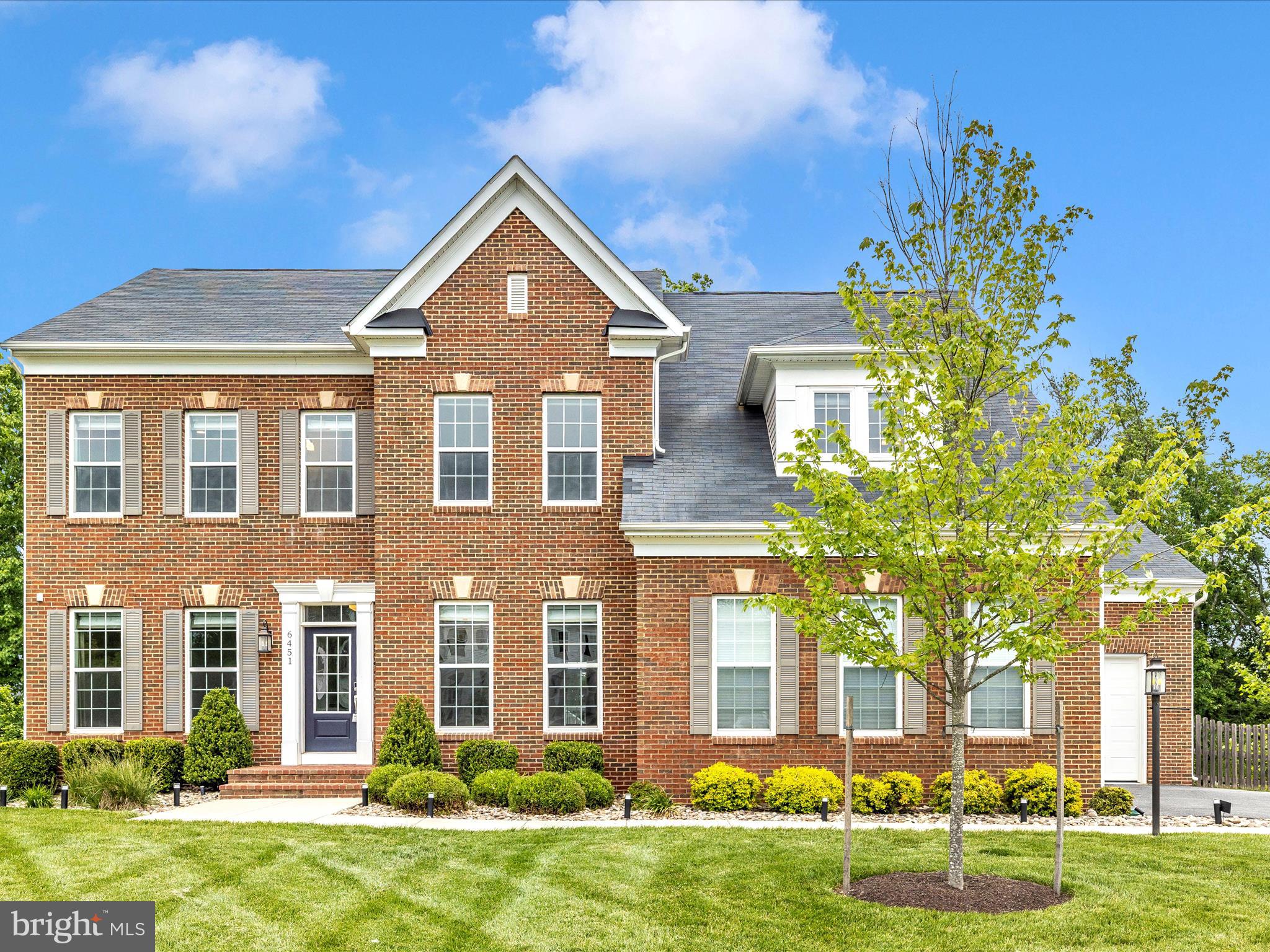 Welcome to 6451 Dresden Place, a stunning and thoughtfully upgraded 5-bedroom, 5.5-bathroom home built in 2018, tucked away in the sought-after Woods at Spring Ridge community and within the top-rated school district. This exceptional residence sits at the end of a quiet cul-de-sac on a beautifully landscaped .46-acre lot backing to trees, offering rare privacy and a peaceful setting. Designed for modern living, this home seamlessly blends spacious elegance with smart features and high-end custom finishes throughout.
Step inside to find soaring ceilings, elegant neutral tones, and an open, functional, inviting layout. The main level features a formal living room (or home office), a large dining room, a sun-drenched morning room, and a cozy family room with a gas fireplace. The gourmet kitchen is a showpiece, featuring a spacious center island, breakfast area, butler’s station, and a fully customized walk-in pantry—a dream setup for any home chef or Costco shopper. Additional main-level highlights include a stylish powder room, mudroom, and laundry room with built-in storage.
Upstairs, the luxurious primary suite includes a sitting area, dual custom walk-in closets, and a spa-like bath with a soaking tub and tiled shower. Each of the three additional upper-level bedrooms features its own private en-suite bathroom and custom-organized closets.
The fully finished lower-level walkout feels like a third living space, offering full-size windows, high ceilings, and an expansive layout. Enjoy a large recreation room with a built-in bar, a fifth bedroom and full bath, a game room, a den, and abundant storage. Custom built-in bookcases and two twin Murphy beds provide flexibility, making this space ideal for guests, work, or play.
Step outside to a beautifully reimagined backyard oasis featuring a maintenance-free upper deck with a programmable Markilux automatic awning, a custom paver patio with covered seating area and built-in fire pit, a professionally regraded backyard with elegant stone retaining walls, a fully fenced yard, and a 50-amp hookup by the fire pit—ready for your future hot tub.
Premium upgrades throughout the home include a 50-amp EV charger in the garage, a Nest thermostat, and smart smoke and carbon monoxide detectors; remote-controlled Roman shades in most rooms, blackout shades in all bedrooms, and custom-measured drapery; custom wallpaper accents in select rooms; Lutron dimmer switches and designer light fixtures throughout; custom closet systems with shelves, racks, and drawers in every bedroom; and enhanced pantry shelving and drawers for maximum kitchen efficiency.
Located just minutes from the premier Spring Ridge community amenities, including a swimming pool, tot lots, basketball courts, walking trails, and a scenic hike to the creek and the Monocacy River. This home offers the perfect blend of privacy, luxury, and convenience—close to commuter routes, shopping, restaurants, Historic Downtown Frederick, and much more.
Don’t miss your chance to make this exceptional property your own.