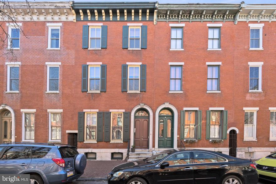 Introducing 1712 Wallace St #102. This bi-level, 2-bedroom, 2-bathroom condominium is located on a tree-lined street in the heart of the Fairmount/Art Museum area. Step inside to a spacious living room, complete with a marble wood-burning fireplace and decorative mantle. Off the living room, an expansive backyard patio—rarely seen in Philadelphia—offers a perfect space for hosting. The primary bedroom and bathroom are also located on the main level. A few steps down, the kitchen features stainless steel appliances and a breakfast bar that seats two. This level includes a new washer and dryer, as well as a second bedroom and full bathroom. Situated just one block from Roberto Clemente Park, this home provides easy access to outdoor recreation. Enjoy the walkability of this location with close proximity to Fairmount Park, Spring Garden Community Gardens, the Art Museum, Eastern State Penitentiary, The Barnes, Kelly Drive, and a variety of shops. Public transportation is easily accessible, and grocery shopping is a breeze with Whole Foods, Giant, and Aldi all within reach. Don’t miss this opportunity to live in the best of Philly.