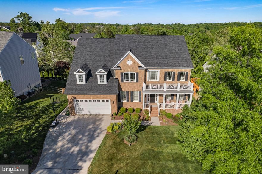 WOW. Just. WOW. This breathtaking 7,000+ sqft custom-built home boasts exquisite design and stunning finishes across 4 levels with 7 bedrooms and 6.5 bathrooms, includes a main-level suite and a versatile fourth-floor loft...a whole home audio/smart home system...and features an entertainer's DREAM on the basement level...

You'll enter this stunning property through the grand hall foyer featuring gorgeous hardwood flooring, flanked by the elegant dining room, a spacious living room w/amazing custom draperies, and a double sided fireplace...setting the tone for a home that’s truly designed for those who appreciate fine living.

The heart of the home features a gourmet kitchen that will make you the envy of the neighborhood!  Equipped with professional grade stainless steel appliances and an expansive island, this space is perfect for entertaining...and creating and enjoying culinary delights. The adjoining family room (complete with a cozy fireplace!) the huge breakfast room, and a bright and light sunroom provide ample entertaining spaces. Enjoy your private library, featuring an enormous bay window w/custom built in settee while your guests enjoy a spacious main-level guest room with an en-suite bath.

The luxury continues upstairs into in the spacious primary suite, featuring a sitting room with a custom-built coffee and wine bar for peaceful retreats, a private covered deck, and a huge double-sided walk-in closet with custom built-in cabinetry that will ensure you never have closet envy again! The en-suite bath offers a sanctuary-like feel, complete with sophisticated finishes, a soaking tub and a separate shower. This level also features enormous secondary bedrooms including a Jack & Jill suite, a private prince/princess suite, and an enviable bedroom-level laundry with ample storage and custom cabietry.

The fourth-floor loft adds an extra layer of luxury with another bedroom, a full bath, a large living area, custom built in computer/study area, and convenient attic access, providing ample space for privacy and comfort.

The walkout basement is an entertainer's paradise! Featuring huge entertaining spaces, a billiards room, a wet bar with a wine fridge, beverage fridge, ice maker, and dishwasher...and your own private cinema, complete with a custom lighted popcorn/snack bar that you just HAVE to see to believe! A spacious home gym, bedroom, and full bath complete the lower level. And the extra-deep 2 car garage will accommodate two large cars plus additional storage!!!

All of this on a cul-de-sac lot with in-ground sprinklers in Potomac Station, featuring community amenities such as a clubhouse, pool, and tennis courts with the convenience of a prime location near major commuting routes and the Dulles Greenway. Enjoy shopping and dining at the nearby Lansdowne Town Center, Downtown Leesburg, One Louduon, and the Villages at Leesburg. Enjoy bargain hunting at the Leesburg Premium Outlets, and rest easy knowing INOVA Loudoun Hospital is nearby. More than just a house…this home represents an unmatched lifestyle in a community rich in amenities, combining luxury, comfort, and a vibrant community atmosphere, all in a prime location near shopping, dining, and essential services. Welcome home to your own piece of paradise!