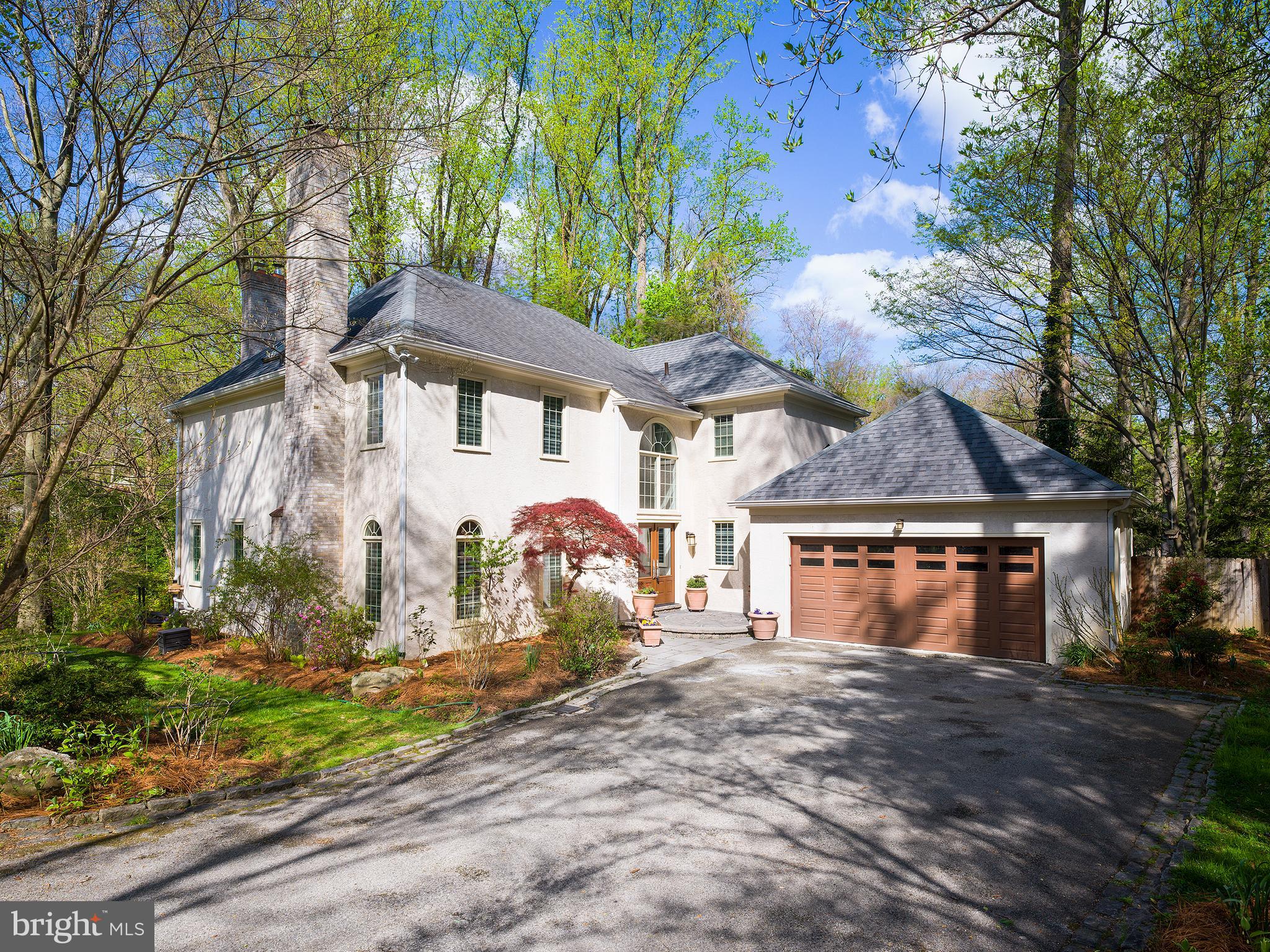 Welcome to 134 Anton Road, a beautiful and peaceful colonial home on a private and quiet street perfectly placed within walking distance of Suburban Square and Ardmore train station. With four bedrooms, three and a half bathrooms, an open first floor living space, and its tranquil backyard, this is a wonderful home to call yours. It is hard not to feel right at home as soon as you enter the warm and welcoming 2-story foyer with large windows that allow sunlight in. To the left of the foyer is the beautiful formal living room with hardwood floors, a gas fireplace, gorgeous atrium windows and built-in shelving that can be used to display books, family photos or anything you want to help personalize the space and make it your own. On the opposite side of the foyer is the formal dining room with the same beautiful hardwood floors. Down the hallway you will find the first-floor powder room, a spacious laundry room with an exit to the side patio, and an entrance from the large 2-car attached garage. The family room is spacious and features a Regency stone fronted wood burning fireplace with blower, and is a perfect place to relax, watch TV, or spend time with family and friends. The family room has an open flow into the gorgeous and updated kitchen, which features crisp white cabinets, updated granite countertops, a large center island with barstool seating, and high-end stainless-steel appliances. The appliances include a Jenn Air 4 burner electric stove with grill, a Miele dishwasher, a sub-zero refrigerator, and freezer, as well as a Dacor double oven. Wonderful luxury vinyl tile floors are found in the kitchen as well as a wet bar area with a second sink. Off the kitchen and family room space are double doors that lead to the back deck overlooking the tranquil and serene backyard. You will feel like you are in your own oasis in nature while relaxing on the back deck, listening to the creek run below, and watching the abundant birdlife visit throughout the year. A gorgeous sunroom off the kitchen with windows all around, a high cathedral ceiling, and a gas fireplace is the perfect place to read a book or sip your morning coffee as the sunlight warms you up.
Upstairs you will find the four bedrooms beginning with the spacious primary bedroom with a sitting area, a walk-in closet with built-in shelving and a second double folding door closet. The primary bathroom is exceptionally large and features two vanity sinks, a large soaking tub, a walk-in glass door shower, and a skylight window that drenches the room with sunlight. The second and third bedrooms are well sized and share the fully upgraded hallway bathroom with all new fixtures, faucets, and tile. A large skylight brightens the space. The final and fourth bedroom is currently being used as a workout room and includes a beautiful ensuite bathroom which has also been updated with new fixtures, faucets, and marble tile. The upstairs hallway overlooks the foyer making for an open and roomy feel upstairs. The lower level of the home is currently unfinished and provides plenty of storage space.
Its proximity to Ardmore train station makes for a quick and easy commute into center city while located in a quiet and safe suburban neighborhood. With its wonderful interior updates, its peaceful outdoor living oasis, all while located in the prestigious Lower Merion school district and near an abundant number of private schools, 134 Anton Road will be a pleasure for its new owners.