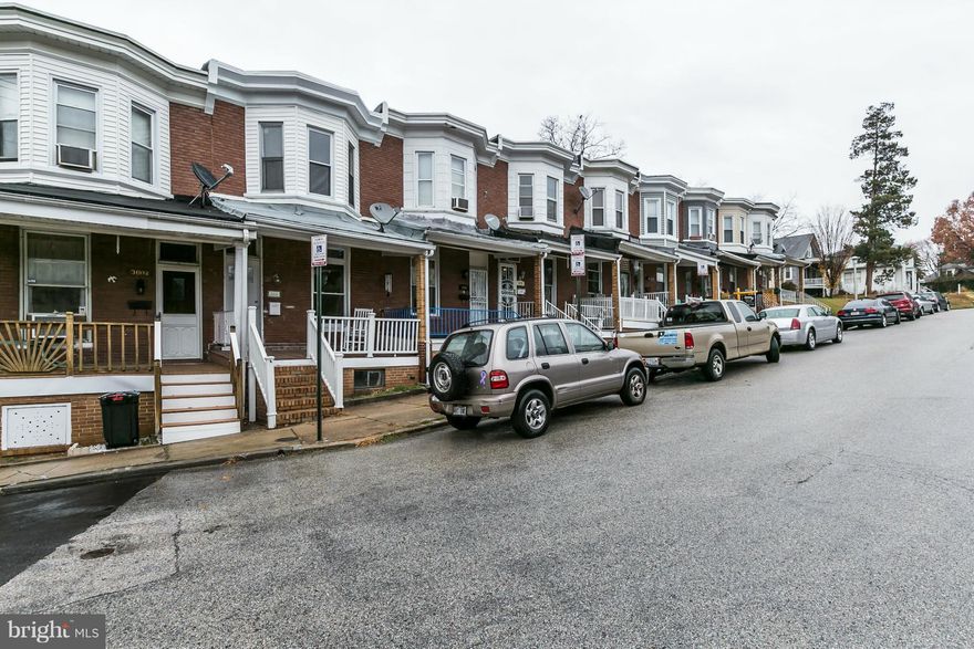 Adorable 3 Bed, 2 Ba porch front home, updated and ready for new owners!  Wood floors throughout, central a/c, renovated kitchen and bath.  Three spacious bedrooms, large rear deck, fenced yard, finished basement.  Kitchen with new cabinetry, stainless appliances and granite counters. Amazing location w/ restaurants, coffee shops all within walking distance.  Perfect starter home!