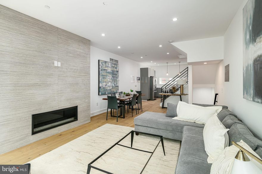 Welcome to the highly anticipated Phase 2 of Regent Row! Tucked between Northern Liberties and Fishtown, this 20 luxury townhome community is located in Olde Kensington, one of Philadelphias hottest neighborhoods. Designed by the renowned architect, Atrium Design Group, these homes will embody the ultimate contemporary living experience. 20 of these homes will be hitting the market featuring over 3,300 square feet of living space, 3 bedrooms, 3 full bathrooms, 1 powder room, 2 car garage parking, a second floor deck, and a spacious rooftop overlooking beautiful Philadelphia views from all directions. Upon arrival into this 20 foot wide home, you will immediately notice pristine engineered hardwood flooring and recessed lighting throughout. The first level is home to a bonus/flex space, perfect for your next office or workout area, 1 powder room and access to the garage. Walk upstairs to the main level of the home where you will immediately notice the open floor plan living room that gives access to the spacious second floor deck in the rear of the home. Off of the living room is the dining area that leads directly into the stunning chefs kitchen. The chefs kitchen features a Bosch stainless steel appliance package, beautiful quartz countertops, tons of high end custom cabinetry, Porcelanosa tile backsplash, and large island with room for barstool seating. The third level has tons of hall space including a loft style setup that lets you overlook the second floor living space, two spacious bedrooms with walk in closets that feature ventilated vinyl shelving, a laundry room and 2 full bathrooms with designer tile, European Style Wall Hung Vanity with room for storage in mirror above vanity. Upstairs is home to the primary ensuite. This incredibly spacious primary ensuite has a custom wardrobe system in the closet and luxury finishes throughout the bathroom, including designer tile and a modern, frameless glass shower door. The primary ensuite also gives access to the expansive private rooftop deck that has stunning city wide views. Down the steps, do not forget about the fully finished basement that is perfect for entertaining guests or storing additional storage! The homes at Regent Row: Phase 2 include a 1 Year Builders Warranty and 10 Year Tax Abatement. Located right across from Phase 1, these homes are placed right where North Howard and Hope Streets meet West Palmer Street. This is in close proximity to public transportation, immediate access to major vehicle interchanges and minutes from some of Philadelphias top restaurants and bars like Suraya, Cheu Fishtown, Frankford Hall & Evil Genius Brewing Company. The neighborhoods proximity to the waterfront and rail lines makes it a walkers dream location! Schedule your tour today, do not miss out!