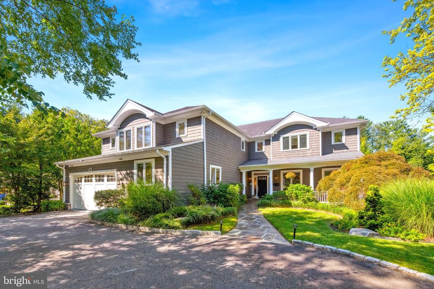 Built mostly new in 1999 as builder David Kelly's own residence, this 5-6BR resort-style craftsman is stunning year round but reigns supreme in the warmer seasons thanks to the gorgeous swimming pool with waterfall, 3-hole putting green, and phenomenal 60' deck overlooking the private rear grounds! Fabulous main level highlights include a dramatic 2-story entry foyer, an elegant living room with fireplace, a formal dining room with atrium door access to the deck, a gorgeous custom kitchen with center island and breakfast area, an adjacent 2-story great room with floor-to-ceiling stone fireplace and oversized windows, a library/family room with built-ins, a home office/possible future bedroom, an oversized powder room, and a terrific walk-in pantry. The upper level offers a luxurious owners' wing with sitting room, wet bar, luxurious bathroom, and two walk-in closets as well as 3 additional bedrooms and 2 additional bathrooms. The expansive walk-out lower level features a large recreation room/home theater with motorized room darkening shades and glass door access to the rear, a professional climate-controlled wine cellar, the 5th bedroom, a full bathroom, an exercise/guest room, and a laundry room with outdoor access. Extra interior/exterior amenities include surround sound speakers, a central vac, lawn irrigation system, and a 2-car garage. Convenient to downtown Bethesda and major travel routes and in the Burning Tree/Pyle/Whitman district, this is a dream home!