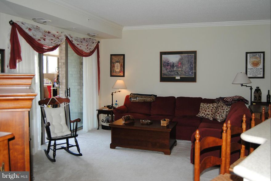 Motivated Seller!    Spacious glass enclosed - Ceramic tiled porch.  Beautiful Garden views!   This popular floor plan features an open kitchen, 2 spacious bedrooms, lots of storage, large laundry room, Crown molding, Insulated honeycomb shades and upgraded lighting throughout! PRICED TO SELL!!!