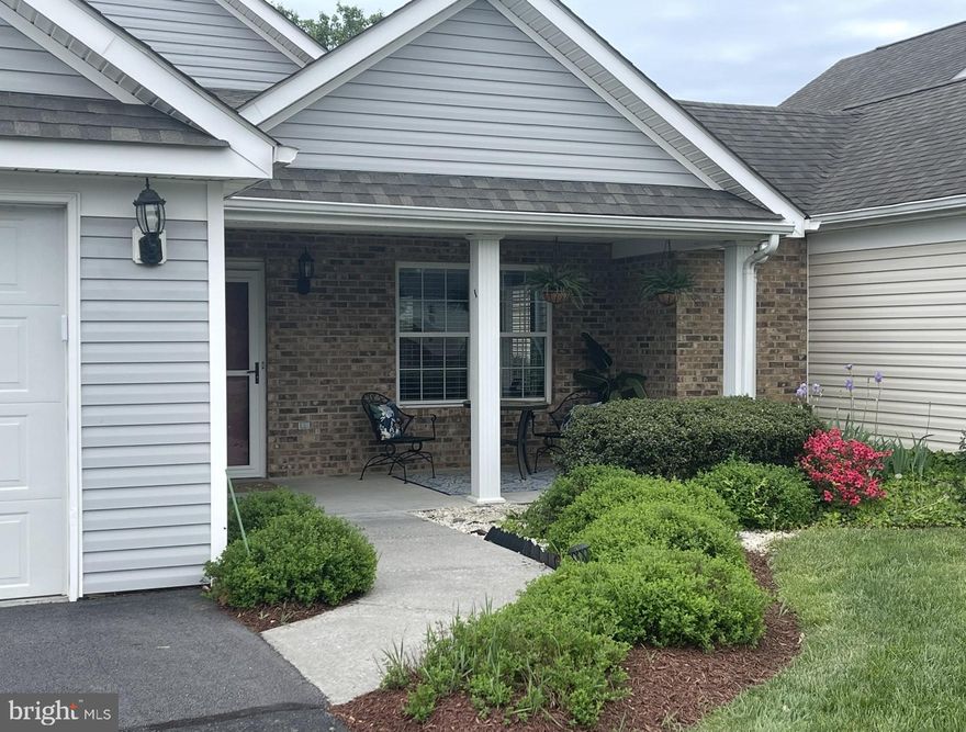 Take a look at this GORGEOUS home in the highly sought after Woodbrook Village 55+ community.  This home is located on a huge corner lot.  Close proximity to conveniences make it an even sweeter spot!  When the seller purchased this home in 2019 they immediately began improvements:  NEW ROOF, NEW FLOORS, PATIO, NEW APPLIANCES.  Not one, but TWO pantries are located in the kitchen as well as a SKYLIGHT!!  You will be amazed from the minute you walk onto the large covered porch where seating and hours of conversation could be enjoyed.  Come inside to a bright open airy feeling of a WELL KEPT home.  Follow thru to the rear of the home where the NEW PATIO with a mature shade tree offers a spot to gather and chat!  The oversized TWO car garage is perfect for that extra storage space everyone needs.  Both bedrooms are great size and one even has a skylight!  This home is PERFECT for anyone 55+ without the desire to be tied down to outdoor maintenance.  Come see it SOON because this FANTASTIC location will not last long.  Schedule your tour TODAY!