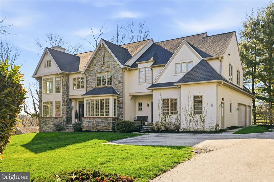 Privately set back on a lush lot, this beautifully upgraded stone colonial offers refined Main Line living.

• Over $200,000 in thoughtful upgrades

• Designer chef’s kitchen renovation with quartz slab surfaces

• Grand two-story foyer filled with natural light

• Great room with fireplace and custom built-ins

• Luxury primary suite with private sitting lounge

• Five spacious bedrooms with elegant finishes

• Flagstone patio overlooking landscaped fenced yard

• Walk-out lower level with high ceilings

• Oversized three-car garage

• Brand-new roof with transferable lifetime warranty

Privately set back from the road on a lush, landscaped lot, this elegant stone-front colonial blends timeless architecture with over $200,000 in thoughtfully curated upgrades.
A dramatic two-story foyer welcomes you into beautifully proportioned living spaces filled with natural light. The gracious living room is anchored by a marble gas fireplace and framed by soaring windows, creating a warm yet sophisticated setting for everyday living and entertaining. Across the foyer, the formal dining room showcases ribbon-inlay hardwood floors, refined millwork, and elevated lighting.
At the heart of the home, the fully upgraded chef’s kitchen and great room create an exceptional gathering space. Custom cabinetry, premium appliances, quartz slab countertops and backsplash, and a striking mosaic marble accent complement the oversized center island with bar seating and secondary oven. The sunny breakfast room flows seamlessly into the inviting great room, where custom built-ins and a gas fireplace enhance both comfort and style.
A sun-filled home office, dual powder rooms, and a secondary entry with laundry and mudroom provide everyday convenience and direct access to the oversized three-car garage.
Upstairs, the expansive primary suite offers a tray ceiling, private sitting lounge or dressing room, and a spa-inspired bath featuring vaulted ceilings, a glass walk-in shower, soaking tub, private water closet, and generous walk-in closets. Four additional bedrooms offer flexibility for family, guests, or workspace, complemented by two well-appointed Jack-and-Jill bathrooms.
The oversized walk-out lower level with high ceilings presents endless possibilities for a home theater, gym, recreation room, or wine cellar.
Outdoors, a flagstone patio overlooks the professionally landscaped and fenced backyard—an ideal setting for entertaining, relaxing, or play.
A newly installed roof with a transferable lifetime warranty provides lasting peace of mind. Ideally located just minutes from Ellis Preserve shopping and dining, premier clubs including Radnor Hunt, and major commuter routes, this exceptional home offers the perfect balance of privacy, convenience, and modern luxury.
