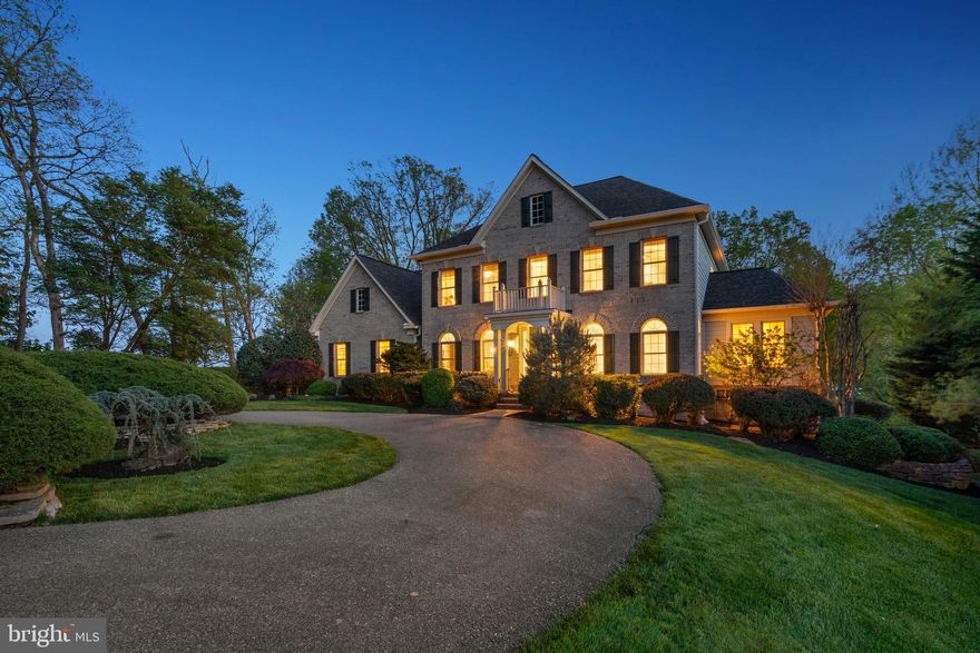 Luxurious 6-bed, 5-bath brick front home with 3-car garage, bucolic lot and nearly 8000 sq ft located on a quiet cul-de-sac in sought-after Laytonsville! This stately home with charming circular driveway is situated on a large picture-perfect 4.3-acre lot with professional landscaping, a flat rear yard with tree-lined views and space to expand or add a pool as desired. Forest conservation area in the rear of the home ensures years of quiet use and nature views. Abundant natural light, crown molding and custom trim welcome you to the grand foyer. The main level is an entertainer's dream - presenting hardwood floors throughout the living room, formal dining room, family room, kitchen and breakfast areas. The gourmet Chef's kitchen is the heart of the main level boasting ample wood cabinetry, granite countertops, walk-in pantry, large island, and stainless steel appliances, including a convenient warming drawer. Savor a morning coffee in the eat-in breakfast area with peaceful views of the rear yard or enjoy a night cap in the adjacent family room with coffered ceilings and cozy gas fireplace. Bonus sunroom addition with natural light from 3 exposures is the ideal space to take in a good book. Main level bedroom with an adjacent full bath offers versatility as a 6th bedroom for guests or as an in-home office. When ready to relax, head to the second level owner's bedroom suite featuring a two-sided gas fireplace, large walk-in closet and an ensuite spa-like bath with tiled floors, dual vanities, soaking tub and tiled walk-in shower. The attached sitting room is ideally-located to serve as an additional in-home office, nursery or reading nook. A secondary bedroom with ensuite bath for long-term guests, two additional large bedrooms with a Jack-and-Jill bath, and a spacious laundry room complete the 4-bed, 3-bath primary upper level. Bonus art studio with new carpet (2024) and separate exterior entrance is located off the owner's suite. The walkout lower level with an additional bedroom and ensuite full bath, large rec room, and extra storage, is perfect for a kids play area, a theater room, an in-law suite or au pair apartment. Looking to de-stress after a long day? Step outside the rear of the home and let your mind wander in the serene garden with wood deck, enjoy an evening under the stars on the flagstone patio, or watch kids and pets play in the flat and open rear yard plus a large storage shed for all your gardening needs. The attached 3-car garage with a long driveway provides all of the space you'll ever need for multiple vehicles, workshop and additional storage. Other recent upgrades include roof (2017) and upper level HVAC (2023).  With an idyllic location, this home boasts the best of both worlds with a bucolic setting on a quiet cul-de-sac, yet just minutes to all of the dining and shopping that Clarksburg and Gaithersburg have to offer. Woodfield ES, John T Baker MS and Damascus HS cluster. Don't miss this jewel of a home!