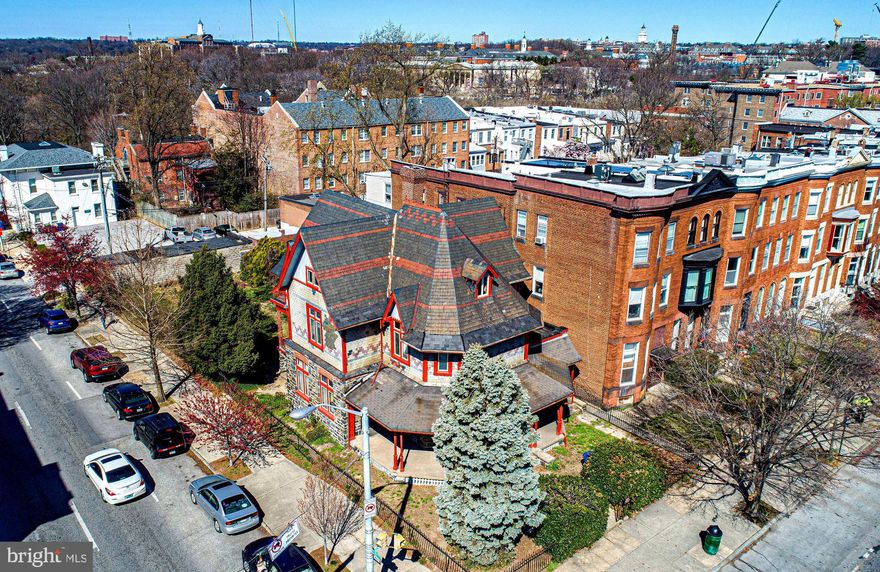 New list price! Welcome to 2900 Saint Paul St. This glorious Victorian sits on a very large lot, just a block or two from the Johns Hopkins University campus in the desirable, walkable community of Charles Village. Built as a country home for the Polk family in 1879, it was one of the first homes in the area. Designed by architect Charles Cassell, whose resume includes many other noted works. It includes voluminous finished space on three levels above grade with a full basement that includes all full height rooms. The basement has direct access to the large, fully fenced rear yard. This iron fence is original to the property. Additionally, there are five garages at the back of the property. It will be a labor of love to bring this home back to the grand state it was in some time ago. The listing documents include a significant volume of information from various sources about the property and its history. Sold as is.