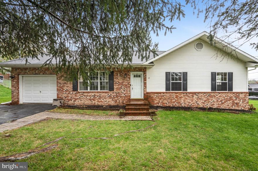 Welcome to 12 Cameron Lane, a quaint 3-bedroom 2-bath rancher in the established neighborhood of Pikeview Acres on a corner lot.   This home offers the ease of one level living with a functional floor plan.  Step inside to find the inviting open living space leading to the kitchen.   The rear deck is very large with a fully fenced in backyard creating an outdoor living environment.  Laminate plank flooring is used throughout the kitchen, dining and living area, while the bedrooms are carpeted for comfort. One car attached garage with additional parking in the driveway.  Schedule your showing today and make this move-in-ready home yours!