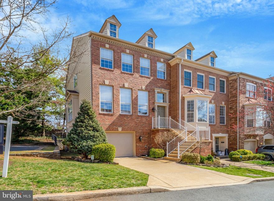 Welcome home to 51 Arell Court! This fantastic brick-front end-unit garage townhome offers spacious, light-filled living in a sought-after location near Metro, shopping, and dining. Inside, you’ll find generous rooms with elegant moldings, soaring ceilings, and a gracious entry that opens to sun-drenched living and dining areas, highlighted by a full wall of windows.

The open kitchen and family room offer easy entertaining and enjoyable everyday living. The kitchen features 42-inch white cabinetry, quartz countertops, recessed lighting, stainless steel appliances, and an island with seating. Enjoy casual meals in the eat-in space or step right out to the deck for outdoor dining.
Upstairs, there are three comfortable bedrooms. The en suite primary bedroom boasts a vaulted ceiling, a custom storage area above the ledge, a large walk-in closet, and a bath with a double sink vanity, deep soaking tub, and separate shower. A hallway separates the primary suite from two additional bedrooms and a full hall bathroom.

End your day by the relaxing fireplace on the lower level reading your favorite book or a glass of wine on the private brick patio. A spacious rec room, a full bath and easy access to the garage and laundry can also be found on this level. 

Freshly painted throughout, this home also features gleaming hardwood floors on the main level and brand-new plush carpet on both the upper and lower levels.

Quaker Village is a friendly community of just 55 townhomes with a suburban feel. The $350/quarter HOA fee covers water, sewer, electric, insurance, landscaping maintenance, pest control, and trash and snow removal.

Conveniently located near major commuter routes, getting around Alexandria and beyond is a breeze! Stop by Whole Foods or Giant at Alexandria Commons—just a four-minute drive—or explore nearby Bradlee Shopping Center for Fresh Market, Starbucks, and more. Minutes from King St Metro, Dash bus stops, Old Town Alexandria, the U.S. Patent Office, National Harbor, Shops at Shirlington, Del Ray, and with an easy commute to the Pentagon, DC, and more!