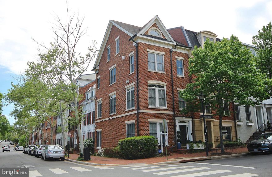 First time available in 20 years, this Madison Model Townhouse features 3 bedrooms/den, 3.5 baths and its own capacious 2 car garage. To the left as one enters the tiled foyer is a bedroom/den/office with new flooring and a full bath-perfect au pair or in-law suite, and a full-sized laundry room. Down the hall is a large rec/family room with a gas fireplace, which leads to the capacious garage, large enough for two cars and extra storage. The generous main living area impresses one with an open dining and living room plan which is enhanced with a gas fireplace. To the right of the stairs is a powder room and kitchen. The kitchen features GE Monogram Stainless Steel Appliances, including a five-burner gas cooktop. A pantry highlights this setup with extra storage, and the breakfast nook completes this area. The Primary level includes a commodious bedroom with a gas fireplace separating a bonus sitting area. The spacious en-suite luxury bath is highlighted with separate sink areas, a spa-like whirlpool soaking tub, sizable shower and a private commode.  The primary level is completed with a den/study/office. Enter the upper-level loft area and you have a choice of relaxing in this separate entertainment space, continuing on the bedroom with ensuite bath, or stepping out onto the terrace for views of Old Town Alexandria or perhaps grilling a sumptuous meal. This end unit has an abundant number of windows which face east and north, making this a very bright, naturally well-lit home. Located perfectly, this fine home is equidistant to the Potomac River and all the attractions of the King Street Corridor. Grocery stores, shopping and restaurants are nearby with EZ access to commuting routes to National Airport, DC and elsewhere.