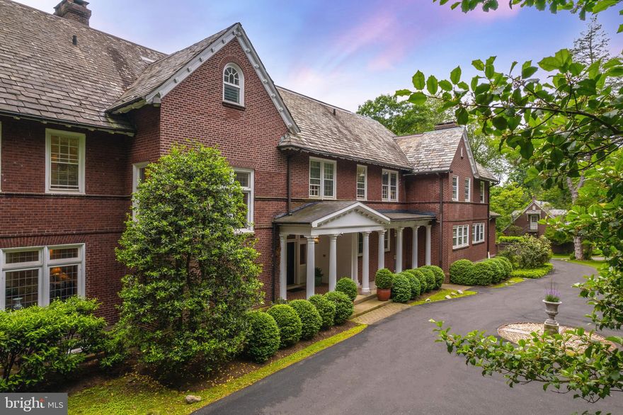 Presenting 437 W Chestnut Hill Avenue, an exceptional oasis surrounded by the lush greenery of Fairmount Park, just blocks from the vibrant shopping and dining along The Avenue. Designed by Arthur Brockie in 1903, this significant and unique property exemplifies a fine Chestnut Hill estate, while attentively updated and upgraded for modern living. Upon walking through the stately front doors to the entrance hall with fireplace, you’ll notice the gorgeous hardwood floors, crown molding, Mercer tiles, leaded glass windows and other original architectural details. The formal living room with fireplace offers a sunlit nook of windows overlooking the rear grounds, while the sunroom provides a cozy space with 3 walls of windows. Sit by the fireplace and read your favorite novel in the paneled study. The large, formal dining room with coffered walls and original molding offers two sets of doors to the kitchen. The bright and open kitchen features a large marble center island, commercial range, Sub-Zero refrigerator and sunlit breakfast area with terracotta tile floor. Step through the kitchen to the relaxing family room with custom built-ins, office and mudroom with pantry and full bathroom. Upstairs, the primary suite offers dual bathrooms as well as oversized closets, one of which is a large walk-in closet with dressing room. Multiple additional bedroom suites as well as the laundry room complete the second floor. The third floor offers extra living space with bedrooms, 2 bathrooms, and a bonus room currently used as a home gym. The grounds of this fine estate are truly gorgeous, with an expansive terrace overlooking mature landscaping, perennial plantings, large pool and separate, updated 2 bedroom, 2 bath carriage house and garage. 437 W Chestnut Hill Ave is in an exceptional location just steps from the trails and recreation of Fairmount Park, a few blocks from the shopping along Germantown Avenue, 2 blocks from the train station, and easy access to major roads.