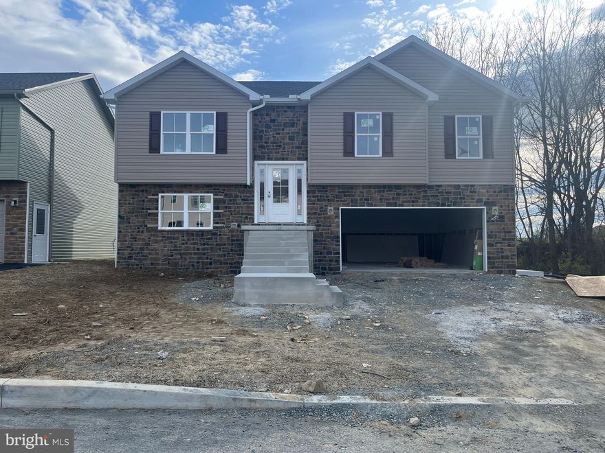 Welcome to Grandview! Grow Healthy Corp is offering a split foyer on Grandview Ave. House is currently under construction, and is slated to be finished 3/15-3/31. Price starts at $289,900, and the seller is offering $5,000 buyers paid closing cost! See the photos for the exterior of  houses, colors and addresses. Interior photos are of a similar house. Each home features an open concept kitchen (island included), dining, and living room areas. All Kitchen appliances included. Granite Countertops, LVP flooring through out, except for the bedrooms, which will have carpet. The master bedroom features its own private bath, along with a closet.  Full Poured concrete foundation. Central A/C and Electric Heatpump, and a 12x12 deck off the rear.  The lower level family room/ bedroom area, and  bath will remain unfinished at the list price. Builder can finish it to match the rest of the property for an additional $20,000. Work can be completed prior to settlement, so you won't live in construction debris! Call today to find out more about this new construction single family home! Main Photo is actual photo of house under construction.