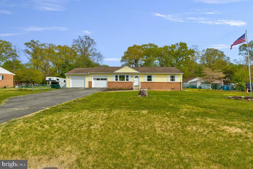 City life with a country feel in your new home! This  3 bedroom, 1.5 bath updated rambler home is complete with beautiful hardwood floors, freshly painted kitchen cabinets with granite countertops and ceramic tile floor, beautifully updated bathrooms,  a large recreation room with pantry and  attached laundry area .  All appliances are included and the home has a newer A/C unit. There is a large back deck with built in seating overlooking a grand back yard that extends well beyond the fence line, complete with a single garage size storage shed. The home has an attached garage with an oversized driveway. It is located just off US HWY 301 with easy access to all your shopping needs. Book this house now! It will not last long!