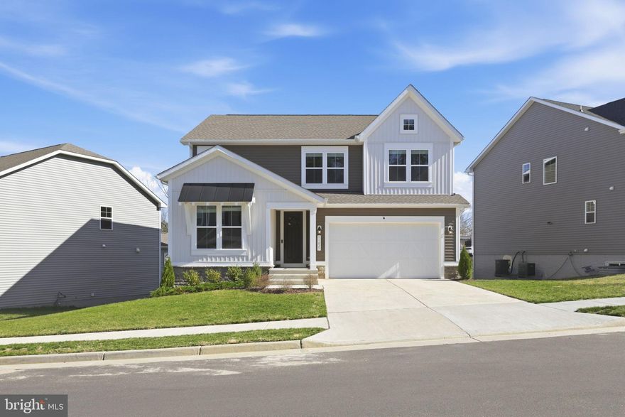 Discover the charm of this stunning new construction home in Harrison Village, designed for modern living. This Colonial-style, two-year-old residence boasts an open floor plan, perfect for gatherings, with a gourmet kitchen featuring upgraded countertops, a spacious island, and a pantry. Enjoy cozy evenings in the family room, enhanced by natural lighting. The fully finished basement offers additional living space with a walkout level, ideal for entertaining or relaxation. Step outside to a beautifully maintained lot that backs onto an open common area, providing a serene backdrop for outdoor activities. The exterior features include inviting sidewalks and street lighting, enhancing the neighborhood's appeal. With an attached two-car garage and a concrete driveway, convenience is at your fingertips. Located in a vibrant community just minutes from shopping, conveniences, and I95! Experience the perfect blend of comfort and style in this exceptional home, ready for you to create lasting memories.