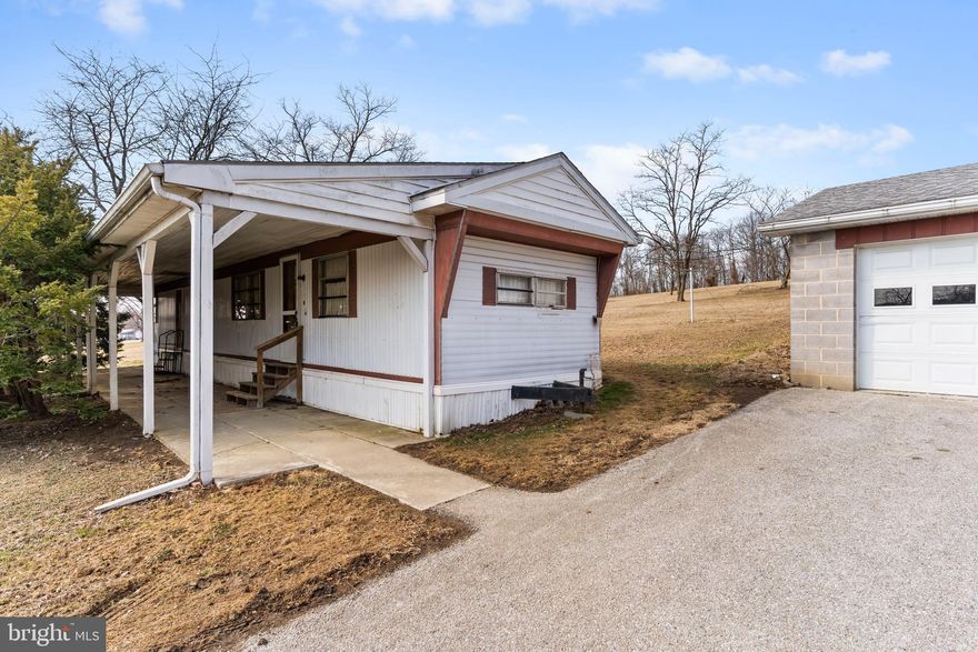 FANTASTIC COUNTRY SETTING IN YORK SPRINGS-Nestled on a generous 0.82-acre lot with easy access to Rt. 15, this well-maintained mobile home has been lovingly cared for by a single owner since 1966. New furnace replaced approximately in 2023. Only 15 miles to Gettysburg, 19 miles to Carlisle, and 22 miles to Camp Hill. The property features a spacious two-car oversized garage, providing ample storage and workspace. If you would like to build a home on this lot, please contact the Huntington Township Zoning Officer directly for more information.