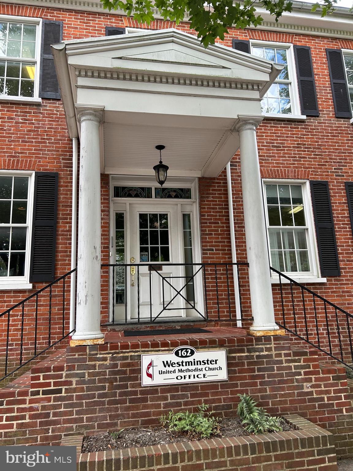 Historic home built in 1846 on Main St in Westminster. This beautiful brick home is well cared for and upgraded over time. There is a Center Hall stairway to second floor. Beautiful, large rooms on first floor, huge kitchen, fireplace in dining/living room. See pictures. The Second floor has 5 individual rooms that could be used as bedrooms (armoires are needed for clothes or closets need to be built in some of the rooms), a full bath, a porch that opens to a view of the back yard, great to enjoy the sun, watch the birds and activities. Parking is off South St to the rear, 5 spaces. The back yard has been used for garden areas, there is a rainwater collection system available for the gardens. Windows have been upgraded to double pane, vinyl clad. Beautiful home with lots of possibilities!