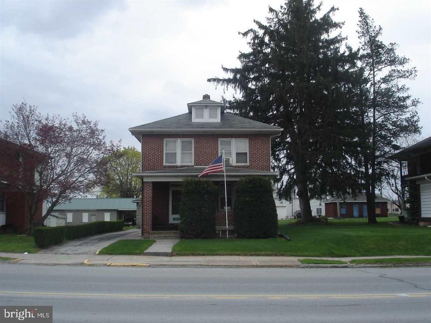 Well Kept Brick Colonial w/Enclosed Back Balcony & Porch adding an Extra Room (24'x6') on 1st & 2nd Floors-Original Stained Chestnut Woodwork  & Doors-Wood Floors under Carpeting-Two Garages-2 Car Garage by alley & 1 car Garage w/wood stove(Room to Putter)-Front Porch (concrete reinforced w/Steel Beams) Business Possibilities-Ck with Monica Love-792-3505-COME VISIT and see if this property can make your dreams come true!