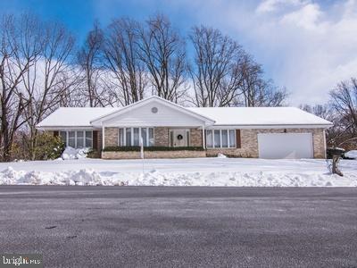 This home is a must see. It's built in the days of true workmanship and pride in the end result. You could not build a home in a more desired location, neighborhood or school district. The four season room over looks a wooded peak that is void of neighbors to the rear of the home. THIS home only needs cosmetics, wall paper, painting etc