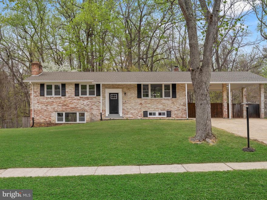 Come see this sprawling Split Foyer offering 5 bedrooms, 3 Full Bathrooms, and wood burning fireplace all on 2 levels.  Stay dry when parking your autos under your private 2 space carport. This home offers comfortable living arrangements, complete with a traditional floor plan and modern finishes that will wow you the minute you walk through the door. The custom kitchen with quartz countertops and stainless-steel appliances offers maximum versatility and functionality. The bathrooms have been tastefully spruced up adding modern elegance to this classic home. Freshly painted and new carpet throughout. The lower level fireplace is an inviting spot to relax serving as a cozy retreat for an evening in. The walk out the lower-level offers the perfect outdoor retreat , entertainment and grilling area, enjoying the usage and view of this expansive property in the large fully fenced backyard area. Schedule to see this home quicky before it goes under contract!!