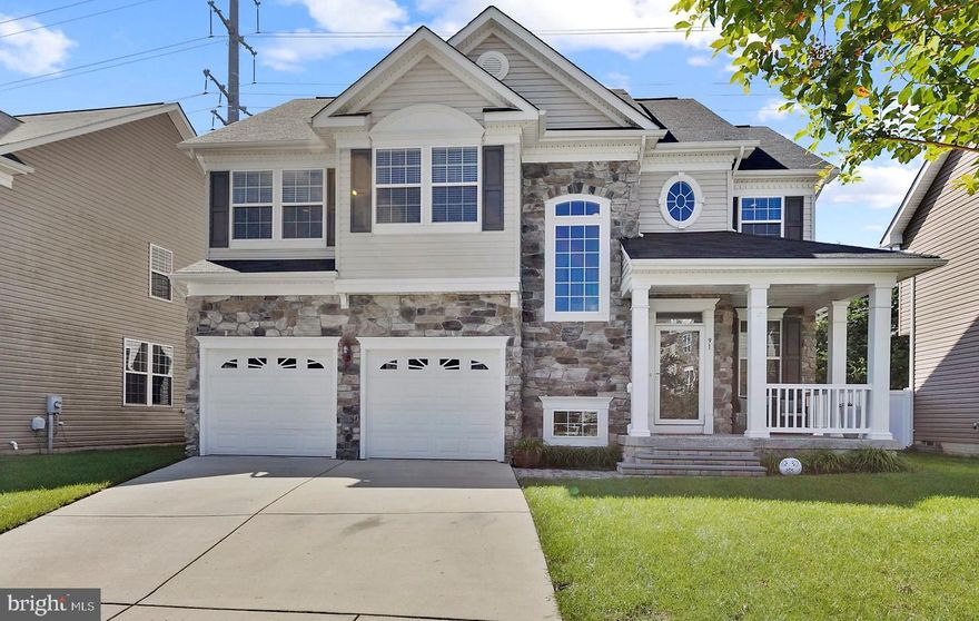 Come home to this beautiful 3 level stone front colonial in sought after Prince Frederick Crossing!!!  The moment you walk through the front door you will love how open and inviting the layout of this house feels.  The large eat in kitchen opens up to the family room and offers granite counter tops, stainless steel appliances, a large island with a cooktop, wall oven, pantry, and tons of cabinet space.  Invite your friends and family over to watch the game in your living room that has built in speakers, recessed lighting, upgraded stone accent wall, and a gas fireplace.  After the game enjoy dinner outside on your maintenance free deck and stone patio.  When it's time to relax and unwind, the master bedroom will do just that for you with its cathedral ceiling and ensuite bathroom with double vanities, a large soaking tub and separate shower.  This house is filled with more upgrades such as a covered front porch, in ground sprinkler system, house intercom system, smart home ready, wood floors, 4 bedrooms on top level, bedroom level laundry room, an unfinished basement to make your own, 2 car garage, 9 foot ceilings, tons of windows to let in natural light, centrally located near shopping, entertainment and schools, and so much more.  The care and love that the seller put into this house shows as soon as you pull into the driveway.  If you want to see this incredible home in person, call me for a private showing today!