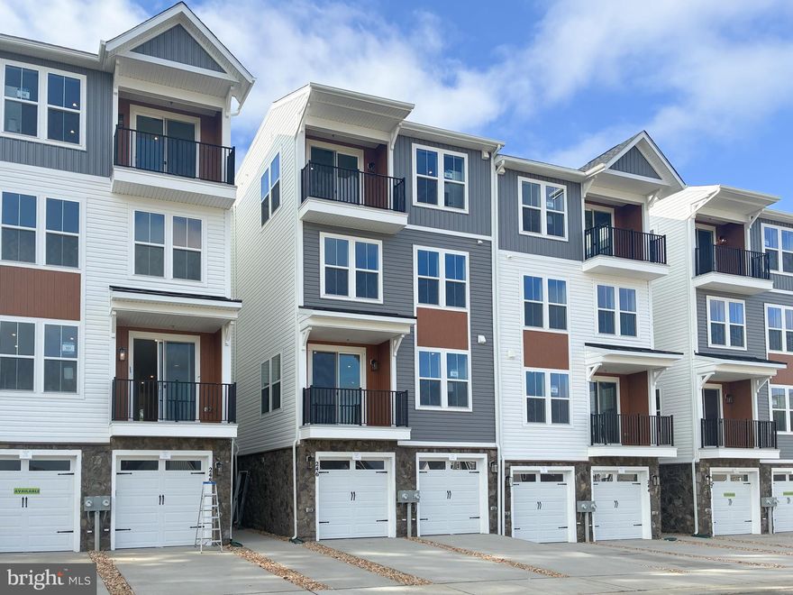 Brand New Scarlet with private elevator located at Cascades at Embrey Mill, an active adult community for those 55 or better, is Ready for move in!!
A private elevator provides seamless access to all floors, transforming daily living with unmatched convenience.
The main level is an entertainer's dream, featuring an open-concept layout that effortlessly blends the gourmet kitchen with the dining and great room. The kitchen boasts upgraded White and Admiral shaker cabinets accented with Calacatta Safyra quartz countertops and brushed nickel hardware. A private balcony off the dining area offers a serene outdoor escape. On this same level, you'll find the spacious primary suite, a true sanctuary with generous closet space and a beautifully appointed en-suite bathroom with sleek white cabinets and Carrera Morro quartz countertops. The convenience of a dedicated main-level laundry room completes this thoughtfully designed floor.
Upstairs, two comfortable secondary bedrooms and a full bathroom offer ample space for family or guests. The versatile lower level boasts a flexible recreation room, ready for your personal touch, and includes an attached one-car garage for added ease.
Immerse yourself in the vibrant community of Cascades at Embrey Mill, a community for those 55 or better,  where good times are already here. Embrace a low-maintenance lifestyle and indulge in a wide array of resort-style amenities. Whether you prefer an active or relaxed lifestyle, Cascades at Embrey Mill has something for everyone. Explore 10 miles of scenic trails, cool off in refreshing pools, cultivate your green thumb in the community garden, or socialize at the exclusive 55+ active adult clubhouse. Elevate your living experience with our luxurious, private elevator townhome-style condos and enjoy the tranquility of over 285 acres of open space, parks, and trails throughout.
Ask about special fixed rate financing and closing costs