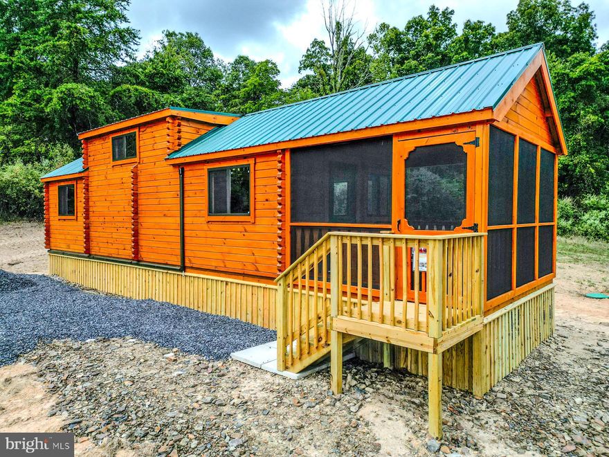 SELLER MOTIVIATED - BIG PRICE REDUCTION!!  **Rustic Yet Contemporary Tiny Home Log Cabin in the Heart of the Appalachian Mountains**  Discover the charm and freedom of living in a true log cabin nestled in the heart of the Appalachian Mountains. This property offers no HOAs to burden or infringe on your freedoms! Whether you're just starting out as a homeowner or considering a real estate investment, you can't go wrong with this delightful cabin.  Owning this property is less expensive then current rental payments.  Investors - the STR opportunities are endless here!  Rustic Yet Contemporary Design!  With functional use of space every inch of this cabin is designed with practicality in mind.  Relax and enjoy the outdoors year-round in any weather on your spacious enclosed porch. The living area offers ample space for a comfortable retreat after a day of adventure.  The fully functional Kitchen includes a breakfast bar for casual dining, all the necessary appliances for convenience with sufficient counter and cabinet space.  Full sized bathroom equipped with all the essentials for everyday living.  The Main Bedroom is 12x10 (approx)  and  can accommodate a king or queen bed with ease or 2 doubles. Washer/Dryer Hookups are included.  There is a Computer/Desk/Storage Area that can easily accommodate bunk beds for additional sleeping arrangements if needed or be utilized as a pantry or large closet.  The massive loft 11x17 (approx) provides space for two queen mattresses, perfect for guests or extra family members.  Mini Split Heat/AC for efficient heating and cooling for year-round comfort that is reliable and convenient.  Metal roof with gutters and downspouts to keep the cabin well-maintained.  Hassle free public water supply.  All situated on an easily maintainable 1.35 acre lot located perfectly near all that West Virginia has to offer, including skiing, fishing, boating, hunting and hiking.  Just minutes off Corridor H/US 48 and close to popular attractions such as Seneca Rocks, Davis/Thomas, Spruce Knob, Vepco Lake, Potomac River, Canaan Valley Ski resorts and Blackwater Falls.  This delightful, affordable, and sensible investment is perfect for anyone looking to embrace the Appalachian lifestyle. Don't miss out on the opportunity to own a piece of mountain paradise before it's gone!!!  ** Seller will contribute a new Residential Starlink Kit with full price offer **