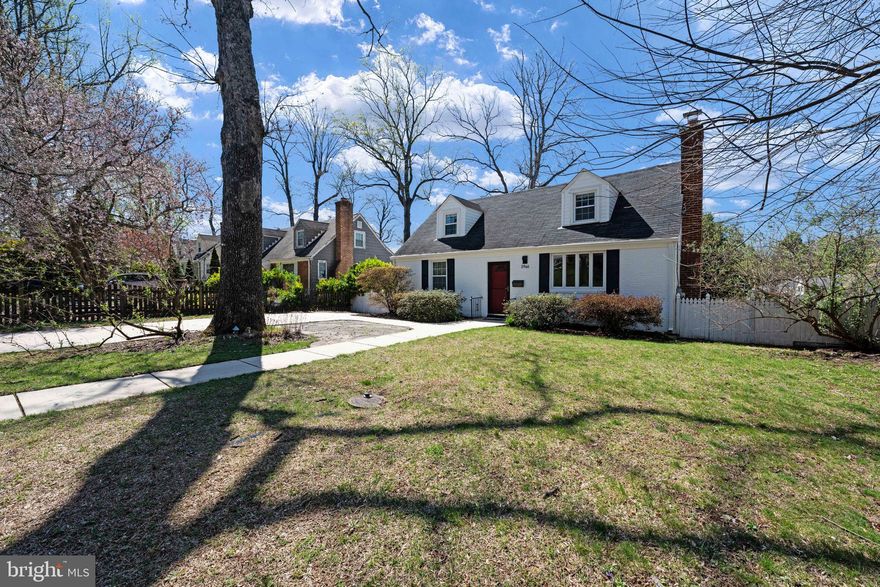 Timeless charm meets modern living in this spacious and beautifully updated Cape Cod, located in Falls Church’s sought-after City Park Homes community! Offering 4 bedrooms, 3 full baths, and an optional 5th bedroom/den in the lower level, this home provides incredible versatility. The inviting, flat front yard and concrete driveway enhance curb appeal and convenience. Step inside to discover an updated open-concept kitchen featuring solid wood blue/grey cabinetry, a striking Quartz waterfall island, and gas cooking—a true chef’s dream! The spacious dining area, illuminated by modern lighting and boasting custom cabinetry, flows seamlessly into the family room.  This space includes built-in storage and a cozy wood burning fireplace. A bright rear sunroom/mudroom/flex space offers endless possibilities.  With a full bath on every level, this home is designed for comfort and functionality. The upper-level bedrooms are both exceptionally large, featuring windows on all sides for abundant natural light.  Both main level bedrooms are nicely sized and share access to the updated main level bathroom.  Solid hardwood flooring spans the top two floors.  Downstairs, the huge lower-level rec room is a standout space, offering natural lighting and a full walkout with direct access to the fully fenced backyard.  A freshly stained main level deck provides additional outdoor entertainment space, and an exterior lower level shed provides optimum storage.  This home has been lovingly maintained and features notable system upgrades: AC, both interior and exterior components, 2017; Water Heater replaced, 2019; Entire exterior freshly painted, 2025; Deck stained, 2025; upgraded double hung windows; upgraded 200 AMP service panel.  Tucked into Falls Church's quaint, tree-lined City Park neighborhood this home offers immediate access to Arlington Blvd and Falls Church City.