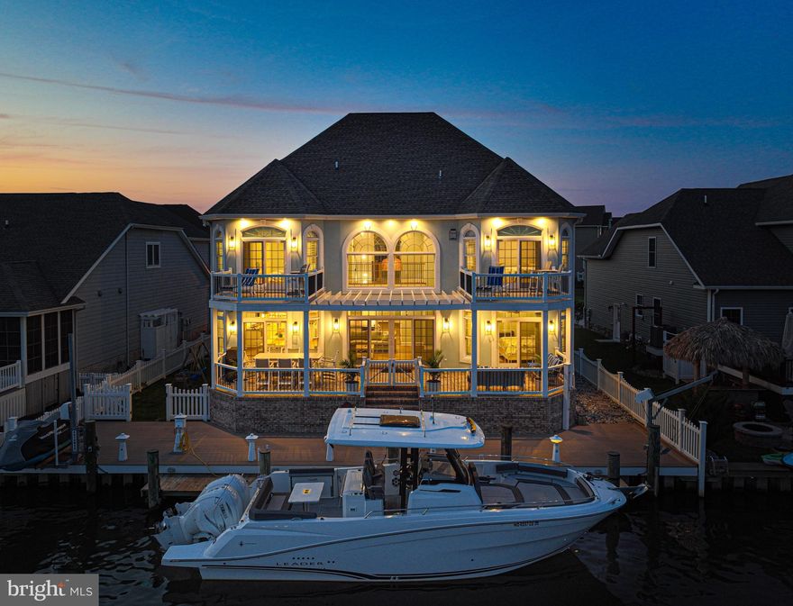 Discover Unparalleled Luxury at 305 S Heron Gull Ct, Ocean City, MD

Welcome to a stunning waterfront estate that perfectly blends luxury and practicality. Spanning over 5,200 square feet, this 6-bedroom, 8-bathroom home offers serene beauty and refined living.

Interior Highlights: Indoor Vinyl Hurricane louvre shutters & LED wall sconces throughout . Every closet custom designed. New furniture & furnishings throughout.

Primary Suite: Each bedroom features its own  suite, ensuring privacy and elegance for family and guests. The first-floor Primary suite includes a luxurious bath and direct access to a waterfront patio. Added first floor combo washer dryer in primary.

Gourmet Kitchen: The heart of the home boasts granite countertops, high-end appliances, and dual sinks, perfect for culinary enthusiasts. The adjacent dining area offers tranquil water views.
Family Room: With soaring 22-foot ceilings and a cozy gas fireplace, this grand yet inviting space is ideal for gatherings.

Entertainment: The third floor houses a movie theater, newly equipped game room with convertible Pool Table / Ping Pong / Hard Tabletop and full kitchen, elevating your entertainment experience. Bluetooth speaker system added throughout home(Wired for google home monitoring and security ).

Outdoor Living: New 20,000 lb boat lift being installed. Vinyl fencing on both east and west sides of home for pet/child friendly home. Rear patio pergola and new vinyl weather resistant table, chairs, bar area and lounges.

Multi-Level Composite Decks: Designed for hosting gatherings or relaxing under the sky.

Private Pier: Features a deep-water dock, boat, and jet ski lifts, guaranteeing endless water-related activities.
Community Amenities:Located in the amenity-rich community of Heron Harbour, residents enjoy access to indoor and outdoor pools, a fitness center, tennis courts, and more.

Prime Location: Just a short distance from the beach, shops, and dining options, this property offers a blend of tranquility and accessibility.

Priced competitively, this home is ideal for those seeking a sophisticated yet welcoming environment. Embrace a premium lifestyle at 305 South Heron Gull Ct.... Schedule an appointment today!