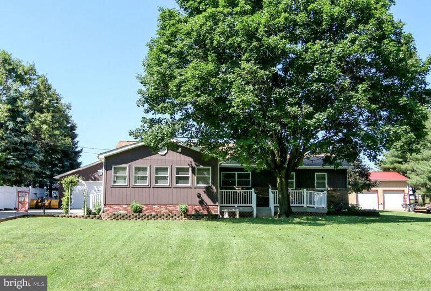 Charming home in quiet setting-- lovingly maintained. Extra LARGE Kitchen with new cabinets, perfect for entertaining. Very large Living room and Family room. Front Porch and back Deck(Trex). Porch Swing and outdoor Hot Tub.Master Bedroom with Dual Closets and Full Master Bath. Large lot (.58 acres).  Two Driveways and 2 Multi-Vehicle Garages.  Double shed.  Great landscaping. The perfect HOME!