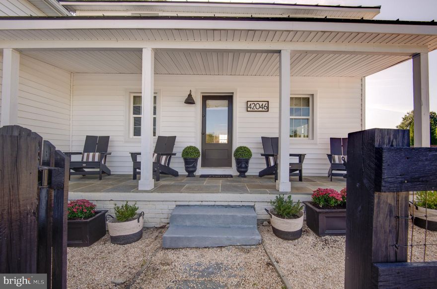 Turn-key, rarely available equestrian property with restored and expanded farmhouse, 4-stall barn, and riding arena on 16 acres with Fios high-speed internet in sought-after Leesburg, Loudoun County. This unique property features a meticulously restored interior that preserves historic character while offering modern systems and a 3-car garage. With quick access to downtown historic Leesburg, Lovettsville, the MARC Train, and the Dulles Greenway, it delivers a complete equestrian lifestyle combined with the convenience of connectivity for work or study from home.

The equestrian amenities are thoughtfully designed and highly functional. The Amish-built 4-stall barn features four 10 x 12 stalls with a center aisle that allows excellent ventilation, keeping the barn cool in summer, while the sturdy construction maintains warmth in winter. The barn includes a wash and grooming stall, a heated tack room, and interior stairs to the hayloft that holds 400 square hay bales and room for extra storage. An 80 x 120 sand and bluestone riding ring is just steps from the barn, ideal for daily training. The property has four fenced paddocks for turnout. An expansive rear field allows for galloping and cross-country schooling without leaving the property or future additional turn out. Additional structures include a large run-in shed and a tractor shed. There is excellent room for horse trailer parking and easy access for your farrier and vet.

A classic farmhouse front porch extends across the front of the home, offering a welcoming and authentic farmhouse entry. Inside, the original farmhouse features a living room with exposed beams overhead and heart pine floors showcase the surprisingly scaled dining room that comfortably seats 12. The gourmet kitchen is designed for the serious cook with a six-burner dual-fuel range, a large quartz island with seating for five, a farmhouse sink, round mosaic backsplash, and generous cabinetry.  A nearby cozy sunroom is the perfect spot for daily meals. Beyond the kitchen, an expansive fenced pea-gravel rear entertaining area provides an ideal setting for outdoor dining or gatherings while overlooking the horses in the pastures.

Upstairs in the original farmhouse, the primary suite offers two walk-in closets and a charming bath with clawfoot tub and separate shower, creating a private and elegant retreat. The second ensuite bedroom, currently used as a home office, adds flexibility for guests or work-from-home needs.

The expanded addition above the 3-car garage seamlessly complements the farmhouse, offering distinct and private living spaces including two additional bedrooms, a full bath, a family room, and a den. The layout provides a balance of connection and privacy, ideal for family members or guests. An ultra-expansive mudroom sits between the two wings, with a conveniently located half bath nearby, keeping daily life organized and practical. Windows throughout both areas fill the home with natural light and offer serene views of the pastures

When you are not riding the walking trail along the creek offers a great spot to exercise the dog.  Wildlife is abundant, including bald eagles, red-tailed hawks, deer, fox, and Blue Herons. Located off paved Loyalty Road with nearby amenities including vineyards, breweries, antique shops, golf, and quick access to the Potomac River. Premier equestrian venues such as Morven Park, Loch Moy, Upperville Horse Show Grounds, and the Marion duPont Scott Equine Medical Center are just minutes away, enhancing the equestrian lifestyle this property provides.

This is a rare opportunity to own a turnkey equestrian property in a prime Loudoun County location, with meticulously preserved historic charm, modern living systems, unique layout, and exceptional horse facilities. Very small and mild country HOA -17 homes.