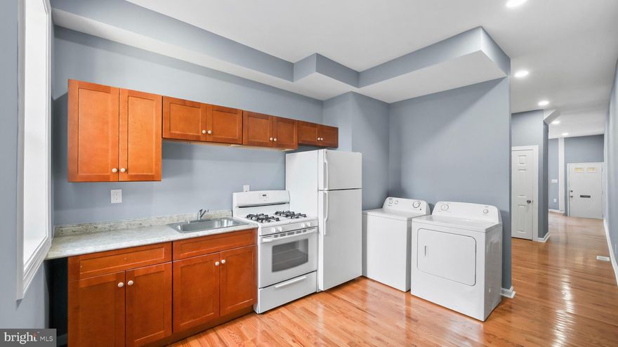 Recently renovated and thoughtfully updated, this property offers a turnkey opportunity for both investors and owner-occupants seeking long-term value. Completed months ago, the renovation was done with full permits and passed all required city inspections. The home has not been occupied since completion, offering a clean and refreshed interior ready for immediate use.

Major improvements include a new electrical system, updated plumbing and gas lines, new HVAC, water heater, flooring, kitchen finishes and appliances, along with fresh paint and modern fixtures throughout. The home also includes a stove, refrigerator, washer, and dryer. The basement provides additional usable space, and the fenced rear yard offers privacy and outdoor flexibility.

With rental projections between $1,850 and $2,000 per month, this property presents strong income potential and a compelling return at the current price point. All required rental documentation is already in place, including Certificate of Occupancy, active rental license, property registration, and lead certification, allowing for immediate leasing.

This property may also be purchased individually or as part of a two-property investment portfolio alongside 215 S Calhoun Street, offering scale and combined income potential for investors seeking multiple stabilized assets.