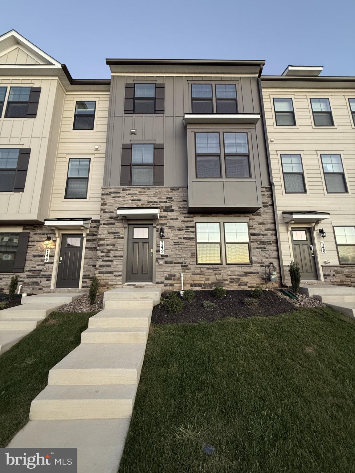 Modern 4-Bedroom Townhome in Sought-After Renn Quarter – Move-In Ready!
Welcome to this beautifully designed 4-bedroom, 3.5-bath townhome at 742 Compass Way in the vibrant Renn Quarter community of Frederick.
Built in 2025, this nearly 2,000 sq ft home blends modern style with comfortable living and is ready for you to move in!
Step inside to find a bright, open-concept main level with luxury plank flooring, a spacious living area, and a chef’s kitchen featuring stainless-steel appliances, granite countertops, a large island, and ample cabinet space. The adjoining dining area opens to a private deck — perfect for morning coffee or evening gatherings.
The upper level offers a serene owner’s suite with a walk-in closet and a spa-inspired bath, plus two additional bedrooms and a full hall bath.
The entry-level fourth bedroom with an en-suite bath is ideal for a guest room, home office, or flex space.
Other highlights include:
    Attached 2-car garage and driveway parking and built-in EV charger port
    Energy-efficient systems and smart-home features
    Convenient laundry on the upper level
    Fresh, neutral finishes throughout
Living in Renn Quarter means enjoying sidewalk-lined streets, pocket parks, and future retail and dining options, all just minutes from historic downtown Frederick, I-70/I-270, and MARC Commuter train service. Close to major shopping centers, Costco, HW stores, Fort Deitrick and Hood College, and hospital.
Top-rated schools and everyday conveniences are close by .Available: immediately ($500 off first month’s rent if you sign rental contract by Oct 31)