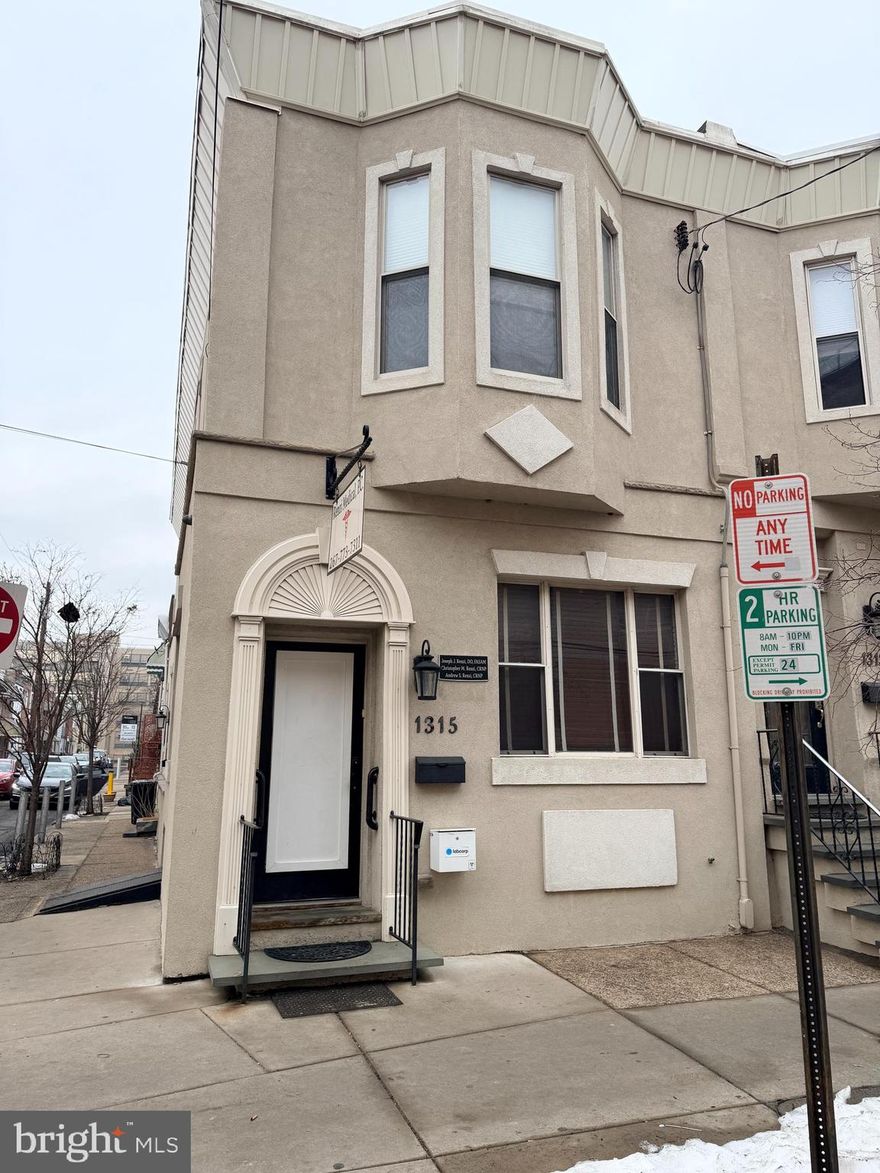 This is a rare opportunity to acquire two adjoining commercial-use properties at 1313 and 1315 Wolf Street, offered together or separately. Each property has its own entrance and deed, with interior access between the buildings supports multi-suite professional operations. Currently improved for medical or professional office use with a mix of private offices, exam rooms, open work areas, and finished lower levels. Residential apartment located above 1315 Wolf Street provides additional income. Both have beautiful custom built in cabinetry for a seamless workflow. Both buildings are configured to support patient/client flow, private work areas, and administrative functions, with fully finished lower levels and multiple points of entry. Combined, the properties offer operational efficiency, flexible space allocation, and potential for owner-users or investors seeking a multi-functional commercial asset across from Jefferson Methodist Hospital.
This is a mixed-use commercial property with professional office layout on the first level and an income-producing apartment on the second floor. The ground floor includes a waiting room and reception area, hall workstation, two bathrooms, three exam rooms, and an office. The finished basement offers a kitchenette, seating area, storage room, mechanicals, and bilco-style exterior egress.  The second-floor two-bedroom, 1.5-bath apartment features hardwood flooring, open living room, recessed lighting, granite counters, stainless steel appliances, in-unit laundry, and a rear deck. The apartment entrance is located on Clarion Street and is currently rented. The first floor office can also egress from the side door and has access to the second floor. Buyer is responsible for verifying zoning and permitted uses.