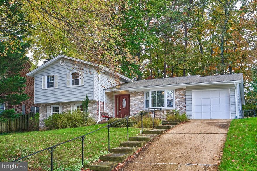 This charming, well-maintained, split-level home, built in 1969, offers a perfect blend of classic design and modern comfort. Nestled in a serene suburban neighborhood on a dead-end street, this home features four spacious bedrooms and three full bathrooms, and an inviting screened-in porch. The interior features beautiful hardwood floors on the main and upper levels creating a warm and inviting atmosphere throughout. Outside, the property sits on a generous 0.29-acre lot, complemented by an attached garage, with additional storage, and driveway parking for convenience. A shed provides additional storage for gardening tools or outdoor equipment. Located in a vibrant community, residents benefit from nearby parks, excellent schools, and convenient public services. The neighborhood fosters a sense of belonging, with friendly neighbors and local events that bring everyone together. This home is not just a place to live; it's a place to thrive. Experience the comfort and community spirit that awaits you here. HVAC 2023; Roof/Screened Porch/Deck 2012; Gutter Helmet 2019; Paint and (most) outlets & switches 2025.