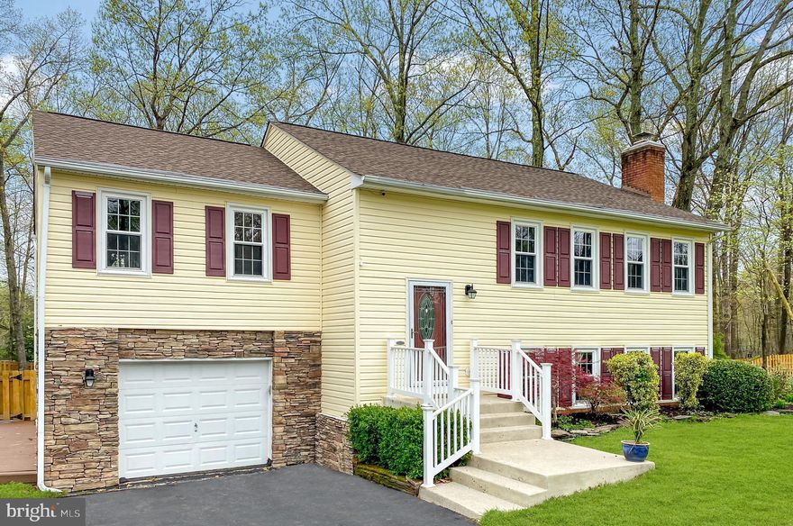 This is a must-see home!  Everything has been updated in the last few years: kitchen, stainless steel appliances, bathrooms, windows, roof, HVAC, water heater, hardwood floors, painting, and more.  Nothing to do, but move in and love it.  This split-foyer home sits on a flat 1-acre lot at the end of a quiet cul-de-sac, with a huge detached 2-car garage and no HOA.  Award-winning schools: Marshall ES, Benton MS, and Colgan HS.  The upper level has an eat-in kitchen, separate dining room, living room, 3 bedrooms, and 2 full bathrooms.  The lower level has a spacious family room with a gas fireplace, a large bedroom, a full bathroom, garage access, and a laundry room with door to backyard.  The backyard is fully fenced; there is a large upper-level deck and lower-level patio. Minutes to I-95 or I-66, convenient to VRE and commuter lots.