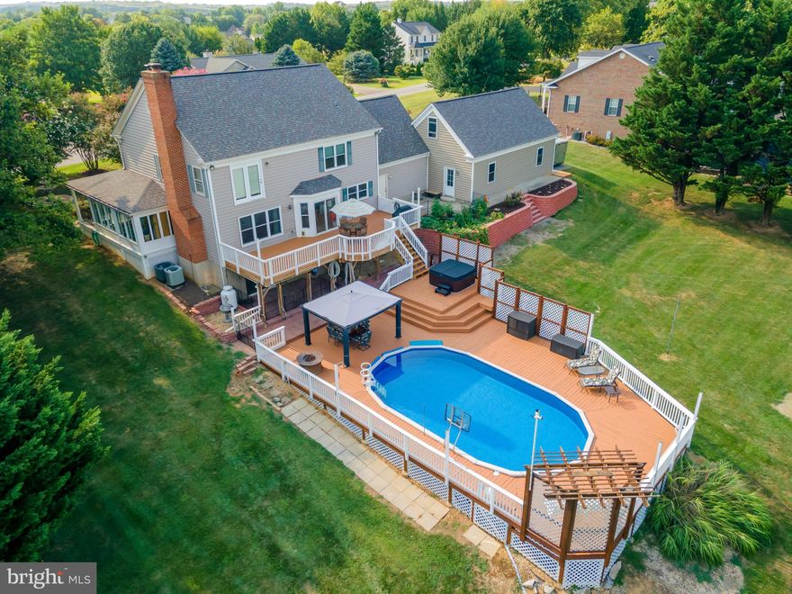 Spacious home on 1.24 Acres with Pool, Hot Tub & 4-Car Garage - in Cloverdale Heights! This 4 bedroom, 3.5 bath two-story home offers over 3,800 finished square feet, including a full, partly finished basement, large front porch, 3200+ sq ft rear deck with swing, pool and hot tub all on a landscaped 1.24-acre lot.  You can’t miss the well-maintained front yard with a beautiful multi-tiered fountain located amongst the long row of blooming crepe myrtles! The flexible floor plan includes a bonus room and upstairs and basement laundry for added convenience. Enjoy outdoor living at its finest with an 18’ x 33’ above-ground pool (52” deep) featuring a new liner (2025) and pump (2024), surrounded by a freshly stained deck. With 3,200 sq ft of total decking plus a new hot tub, this is the perfect property for entertaining or relaxing.  There is an extra gas hook up   on the lower patio area to cook for a turkey fryer/crab pot. Large  kitchen with tons of cabinet space and granite counters. Appliances are newer and include a unique dual fuel stove – gas cooktop with electric oven! The large 4-car garage with heater offers ample storage and space for a workshop. Inside the home you’ll find most windows replaced, fresh paint, updated flooring to include new carpet upstairs, bamboo hardwood on main living areas and ceramic in the kitchen!  The basement includes two soundproof rooms—one with a kitchenette—plus an optional hair station/cosmetic station with plumbing, lighting, and fixtures ready to go. Enjoy the propane stove downstairs or cozy up to the upstairs propane fireplace (leased tank), which can be converted back to wood burning. Washers/dryers as is.
Additional highlights:
Roof replaced in 2017
Dual-zoned TRANE HVAC (8 years old)
Finished sunporch for year-round enjoyment—perfect for morning coffee or game nights
This property blends space, versatility, and modern updates with a relaxing, resort-style outdoor setup