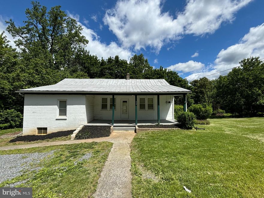 Last minute buyer lost financing.  Check this deal out!  This could be transformed into your new home or would work as a great investment/flip/rental!  Super solid house with no issues, just a little dated.  This home already has all of the windows replaced with vinyl double paned windows.  Hardwood flooring in great shape throughout almost the entire home.  Move-in ready as it is, live in it while you update it and gain the sweat equity!  Two of the bedrooms are very large and could possible add a 2nd bath for a true master suite!  Currently an oil furnace in the basement for heat.  This block home sits on 1.23 unrestricted acres, plenty of room for chickens, dogs, and kids to run around! Foundation is good, floors are level, metal roof shows no signs of leaking.  Nice front porch and enclosed back porch.  Full basement, fine for storage or workshop.