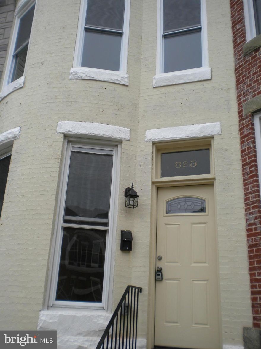 Beautifully restored townhouse in historic Hampden.  Quiet one-way street.   Brand new two bedroom with extra upstairs room.  New kitchen, two new baths, new floors.  All SS appliances to be installed: refrigerator with ice maker, gas stove, microwave, dishwasher, washer/dryer.  Just move in and enjoy.