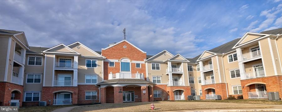 Awesome Severna Park Gateway condo ready for your buyer! Huge living room adjacent to kitchen with granite counters and breakfast bar, pantry, all appliances** 9+ ft ceilings ** Main living areas have luxury vinyl,carpet (bedrooms) and hardwood floors (living room, kitchen, hall) **Crown molding in living room **3 ceiling fans**Balcony off dining area ** Master bedroom has two closets and a full bath with walkin shower **Shades, blinds, drapes convey ** One car garage conveys (number 309)** No front foot fee, no water and sewer bills ** Shows very well !! Ready to show and sell!!